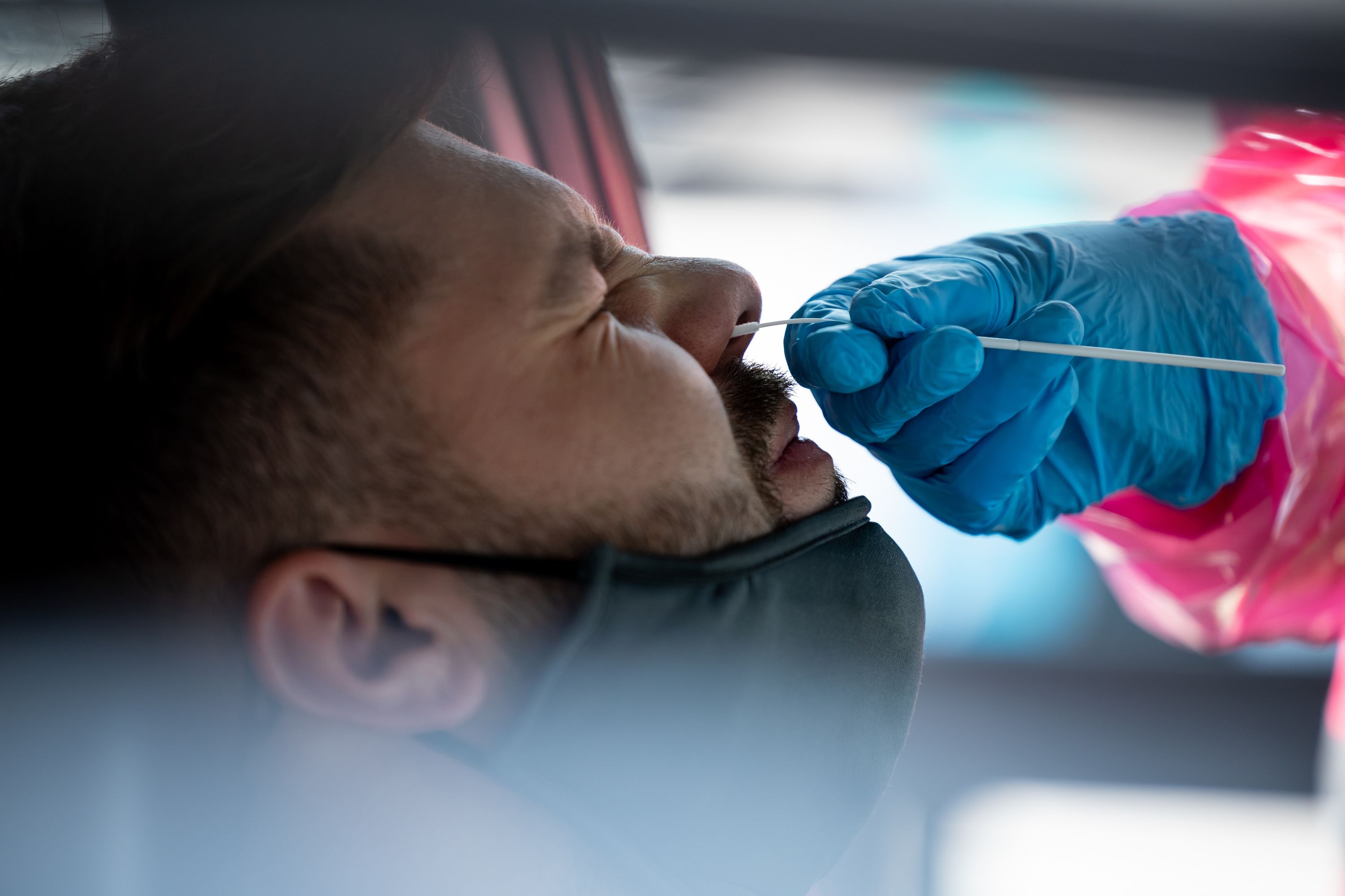 Tristan McGraw gets tested for COVID-19 at a NOMI Health drive-thru test site in West Valley City on June 10, 2022. Amid a summer increase in COVID-19 infections, a new version of the virus has become dominant nationwide.