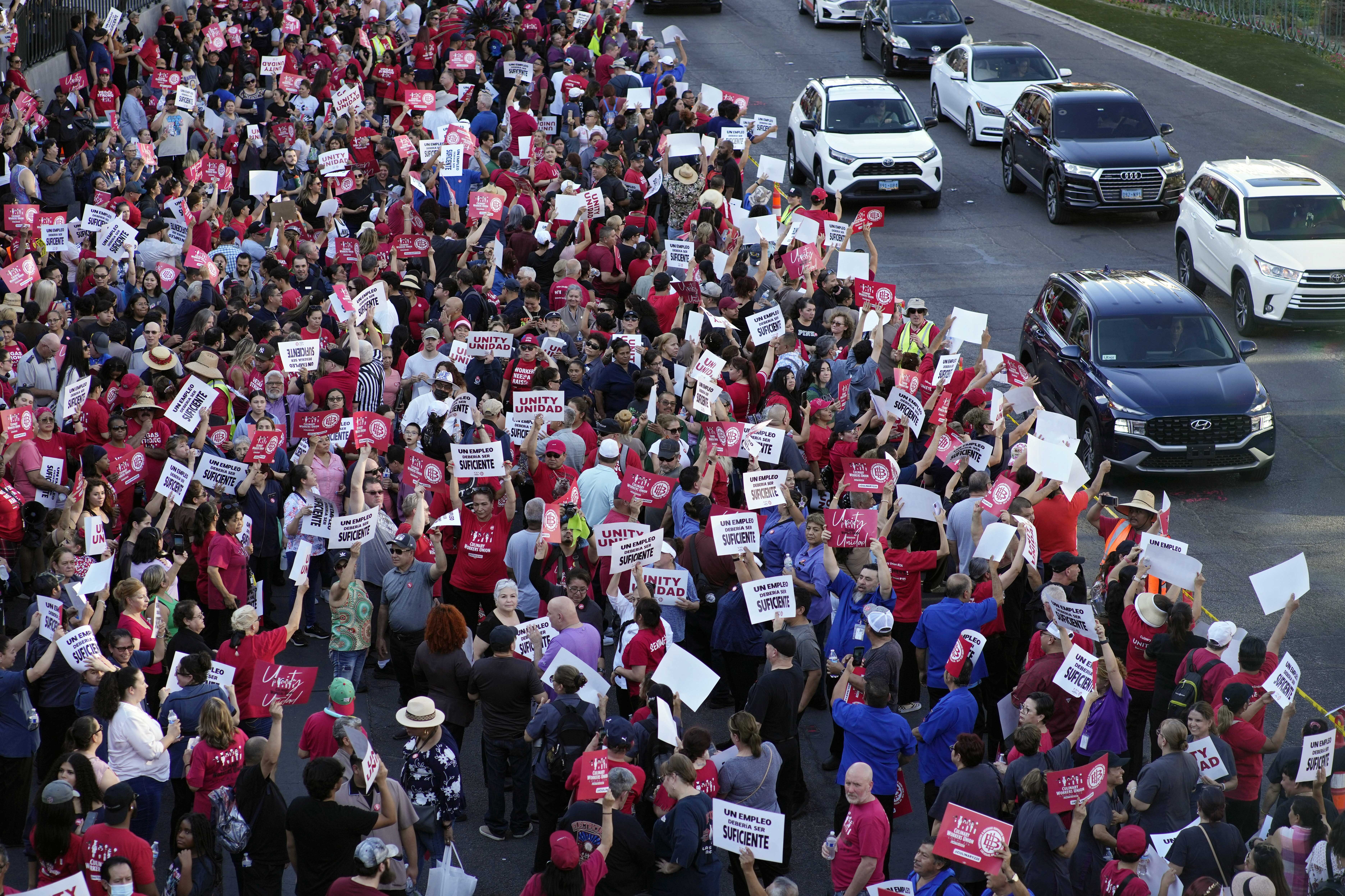 Members of the Culinary Workers Union rally along the Las Vegas Strip Thursday. The union rallied to support servers, dishwashers, cooks and bartenders who work at T-Mobile Arena and have been locked in contract negotiations for nearly a year.
