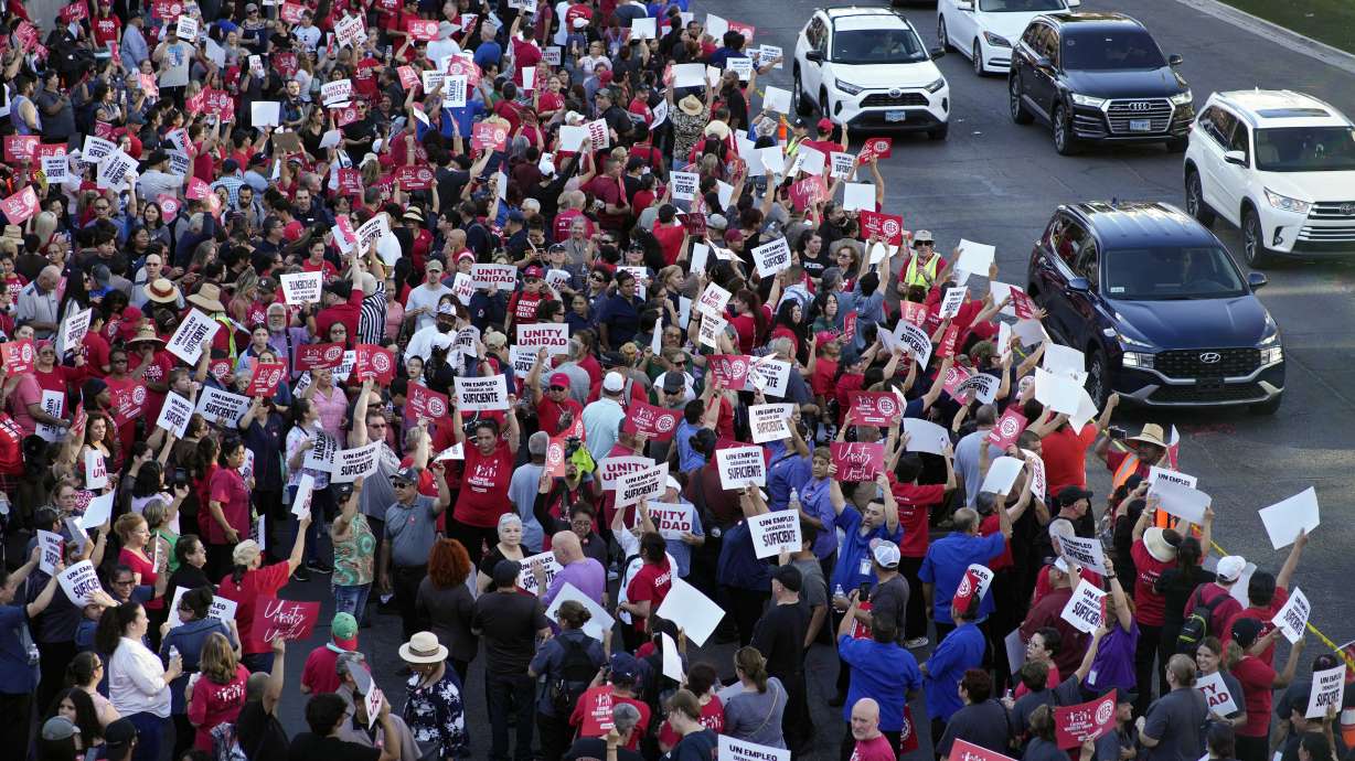 Members of the Culinary Workers Union rally along the Las Vegas Strip Thursday. The union rallied to support servers, dishwashers, cooks and bartenders who work at T-Mobile Arena and have been locked in contract negotiations for nearly a year.