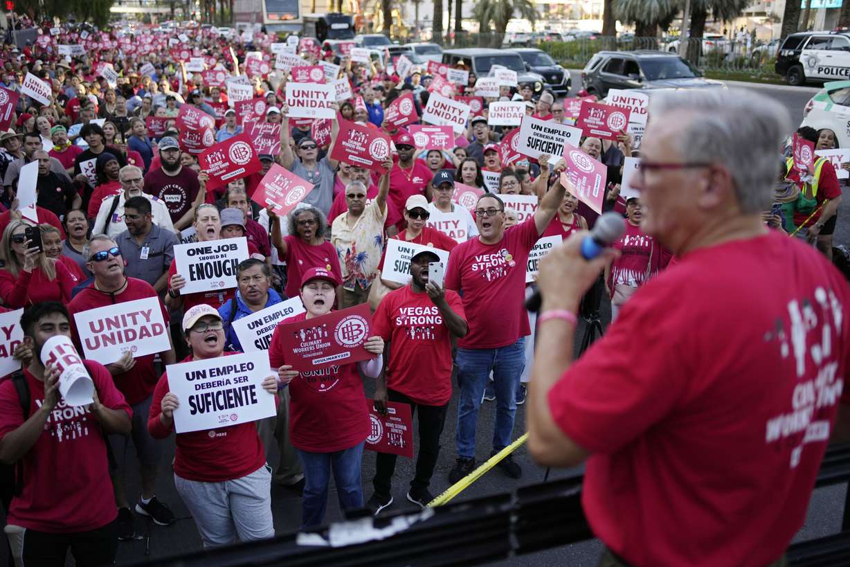 Members of the Culinary Workers Union cheer as Secretary-Treasurer Ted Pappageorge speaks during a rally along the Las Vegas Strip on Thursday in Las Vegas.