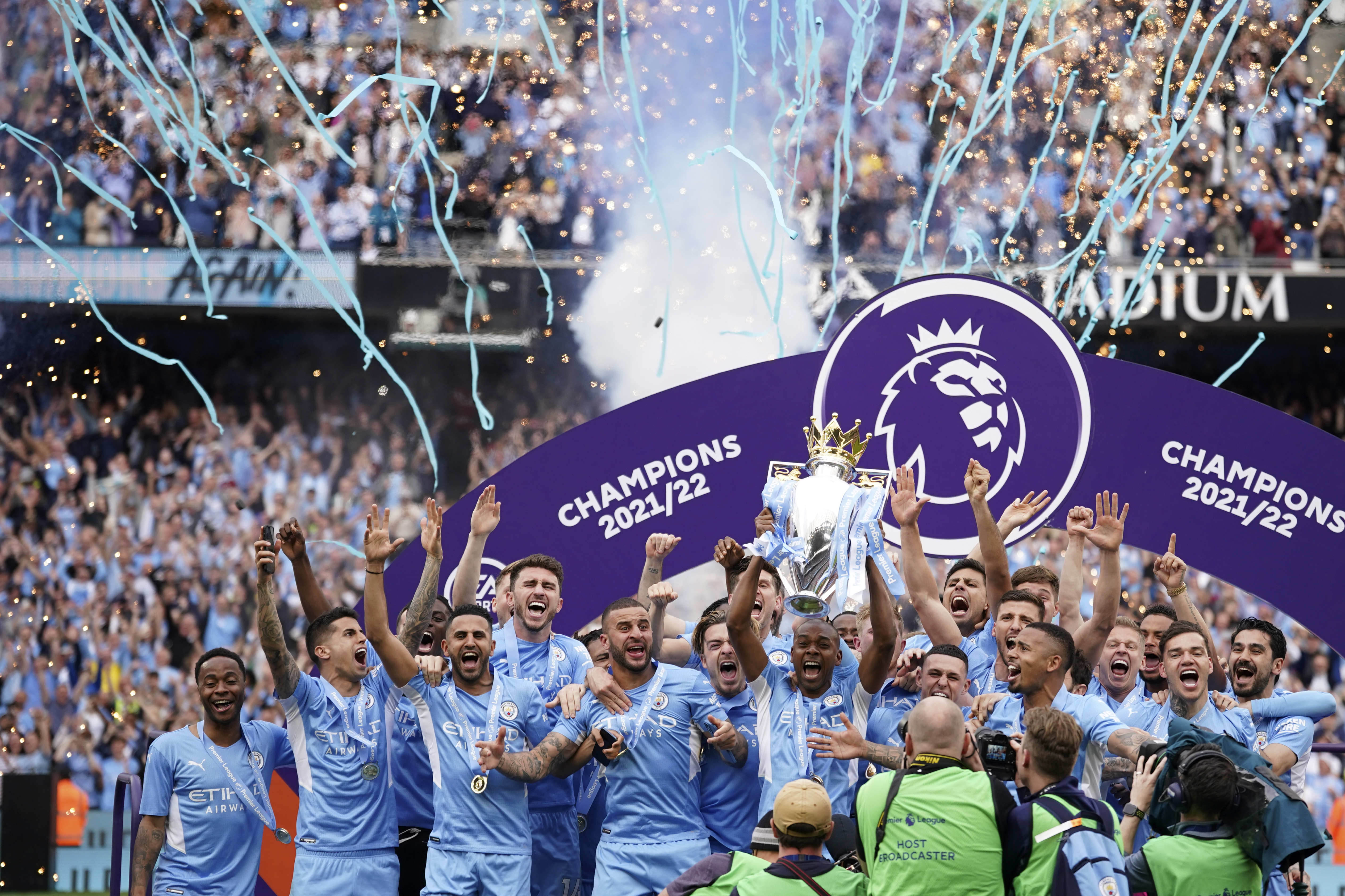 FILE - Manchester City players celebrate with trophy after winning the 2022 English Premier League title at the Etihad Stadium in Manchester, England, Sunday, May 22, 2022. 