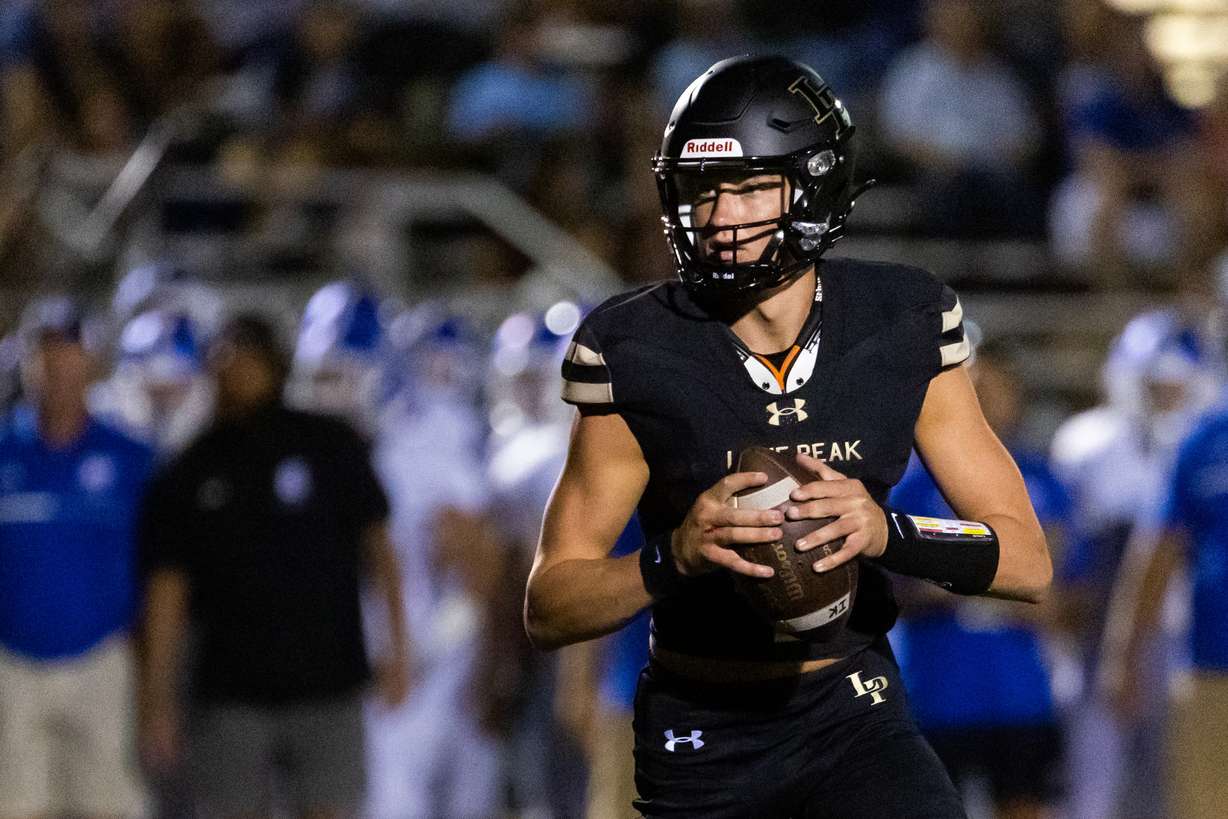 Lone Peak quarterback Jackson Blake plays in the high school football season opener against Bingham at Lone Peak High School in Highland on Thursday, Aug. 10, 2023.