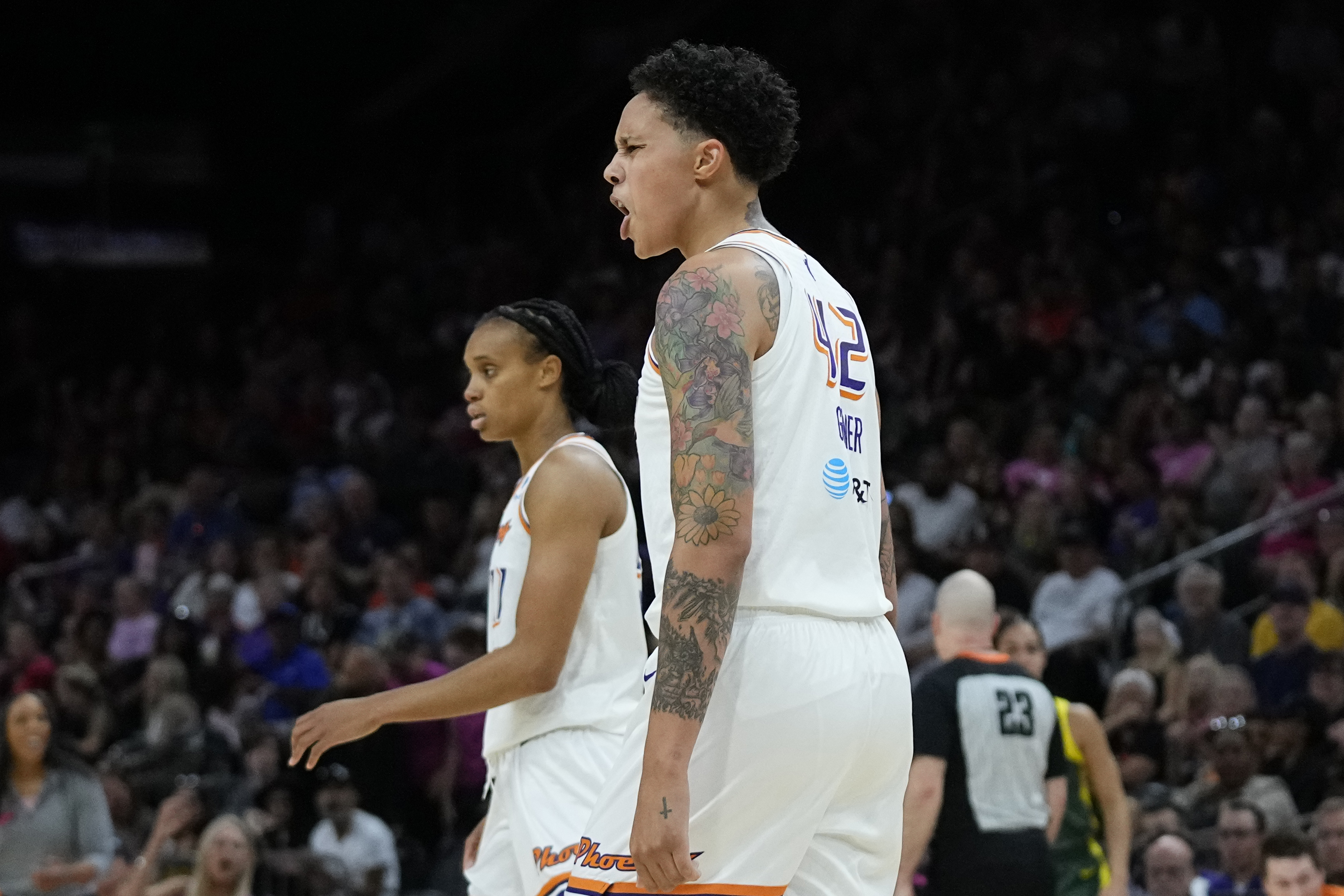 Phoenix Mercury center Brittney Griner, foreground, argues with officials as forward Brianna Turner walks past during the second half of the team's WNBA basketball game against the Seattle Storm on Saturday, Aug. 5, 2023, in Phoenix. The Storm won 97-91. 