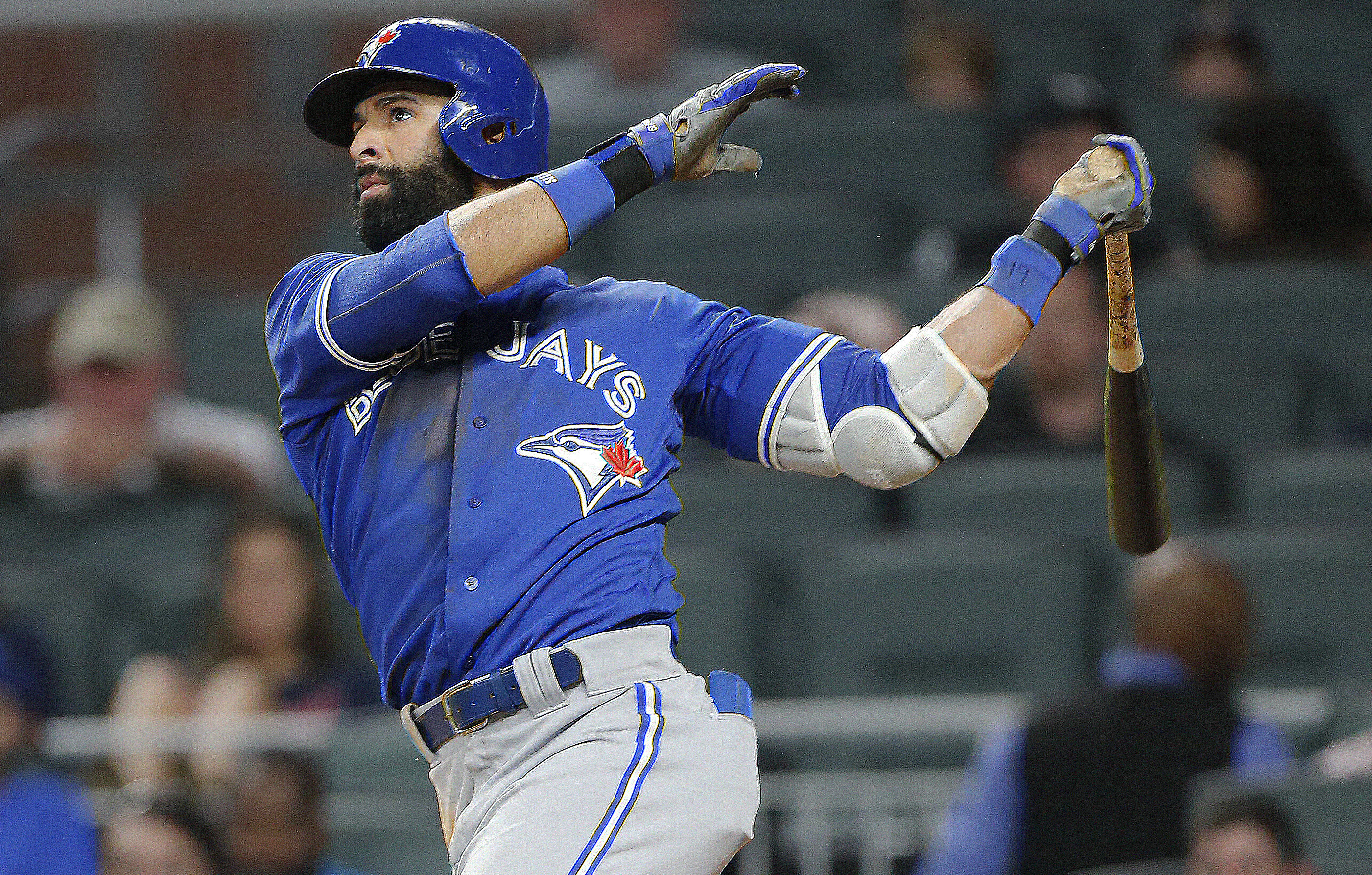 FILE - Toronto Blue Jays' Jose Bautista (19) follows through on a solo home run during the eighth inning against the Atlanta Braves in a baseball game Wednesday, May 17, 2017, in Atlanta. Former big league slugger José Bautista is signing a one-day contract so he can retire with the Toronto Blue Jays. The Blue Jays announced the deal on Friday, Aug. 11, 2023.