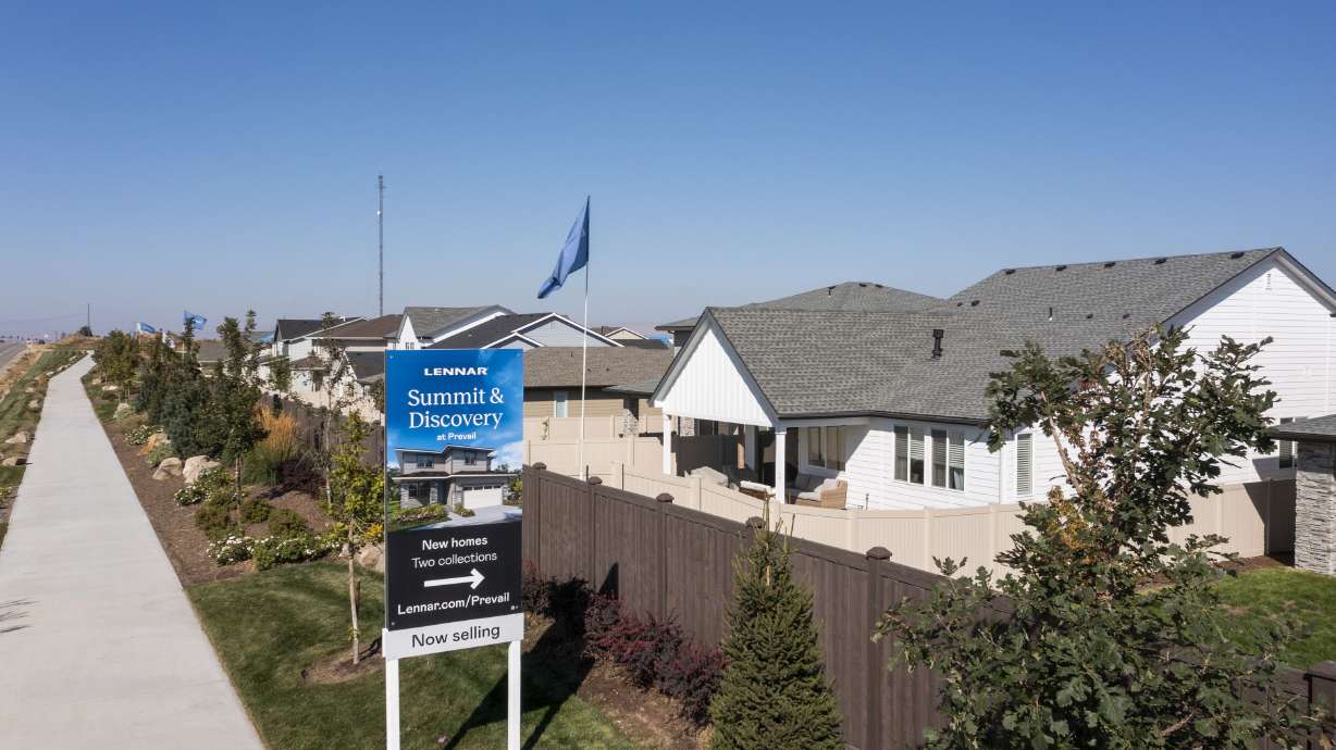 New homes advertise for sale in Meridian, Idaho, on Sept. 23, 2022. The U.S. housing market is continuing to undergo a divided real estate correction, with prices rising in the East, while prices are down in many areas in the West.