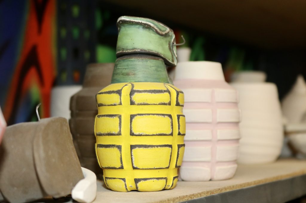 A ceramic item shaped like a grenade by Sun Lotus Designs is pictured, St. George, Utah, Aug. 2. From rocket ships to missiles and hand grenades, this pottery artist is blowing up the art scene in Washington County.