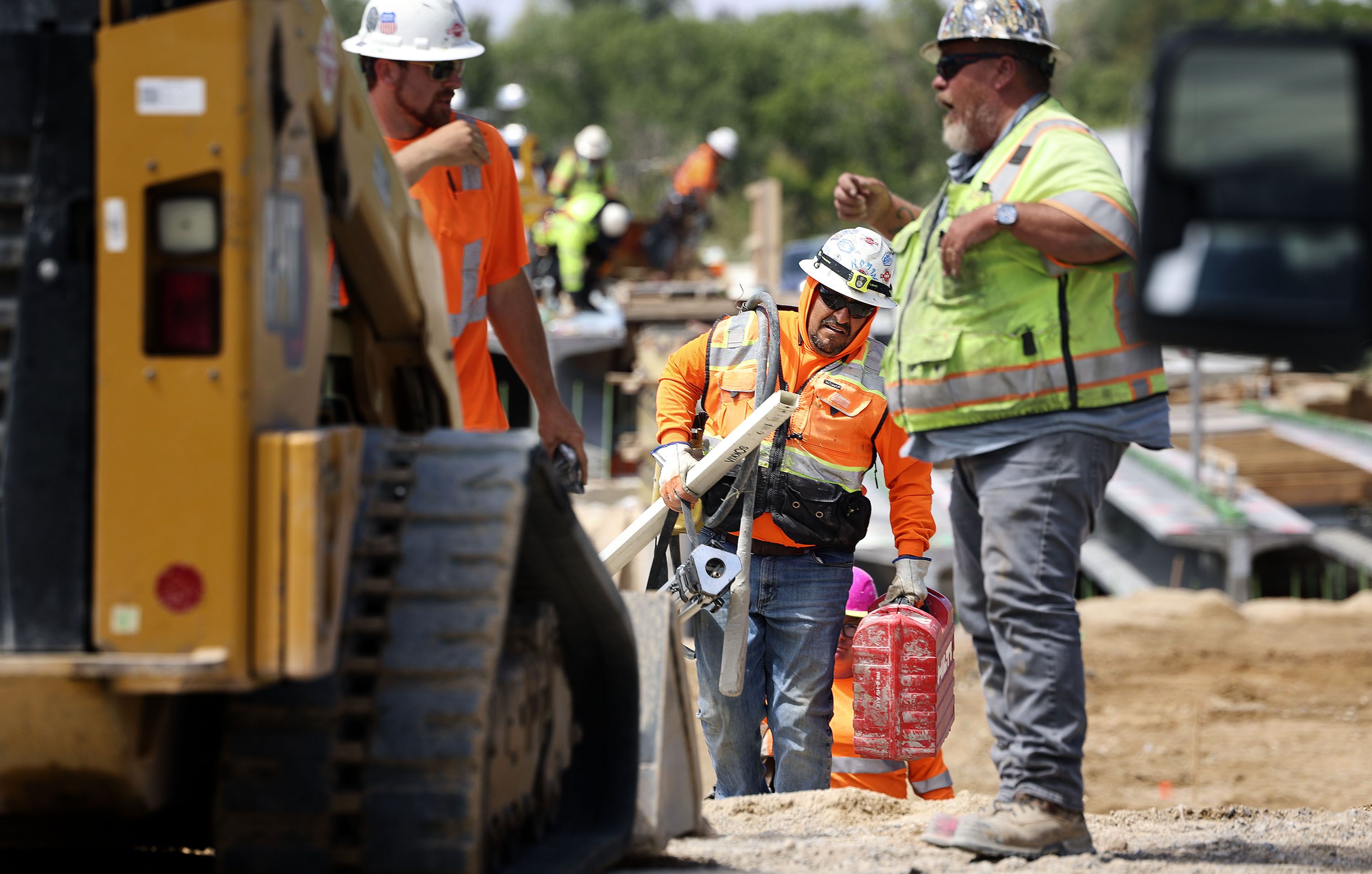 UDOT employees and subcontractors work on the I-80 Renewed reconstruction project in Salt Lake City on Friday.