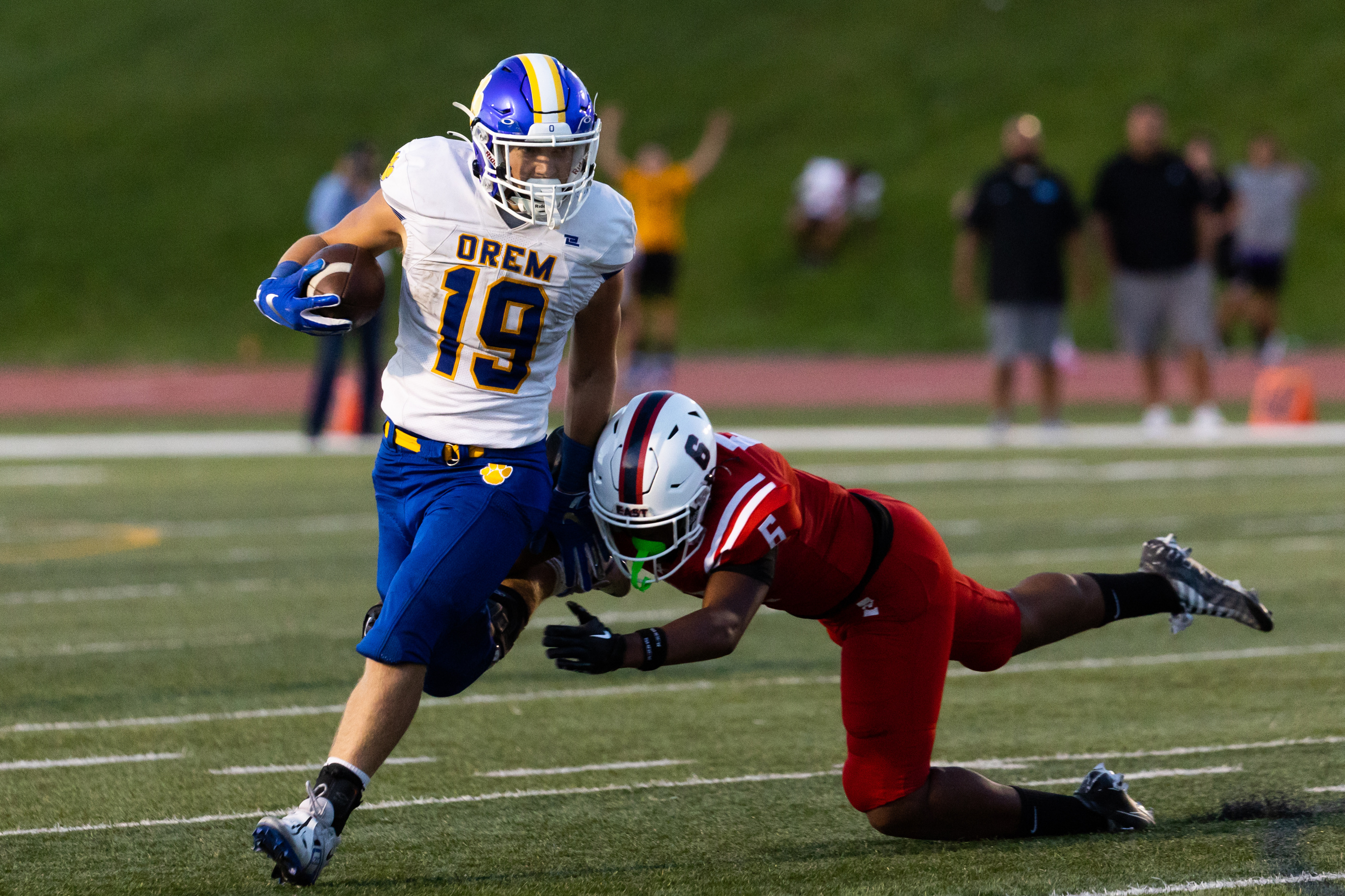 Orem’s Mack Hixson runs the ball at the high school football season opener against East at East High School in Salt Lake City on Friday, Aug. 11, 2023.