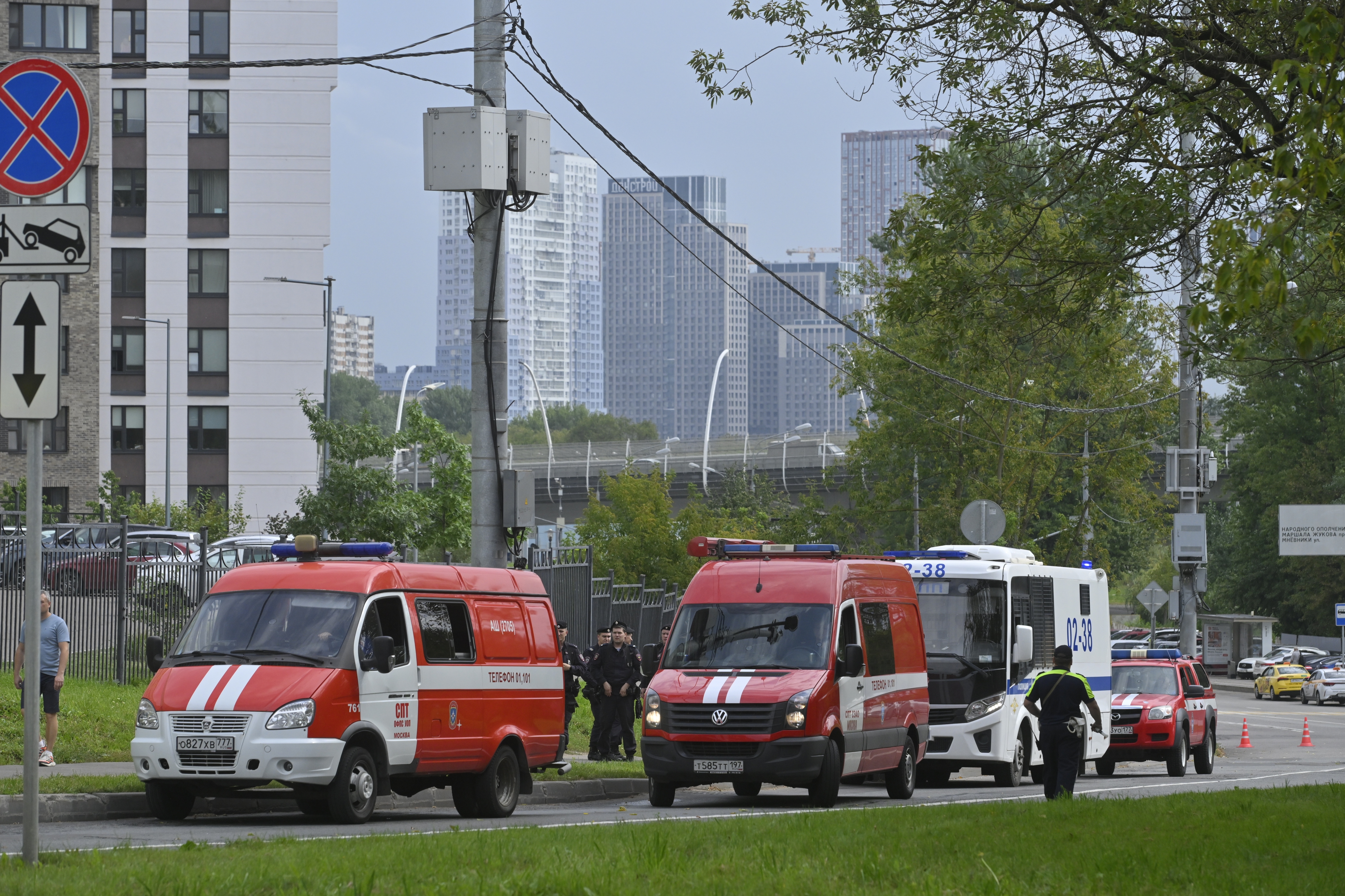 Police and emergency vehicles parked at the side of the wreckage of the drone fell near the Karamyshevskaya embankment after a reported drone attack in Moscow, Russia, on Friday.