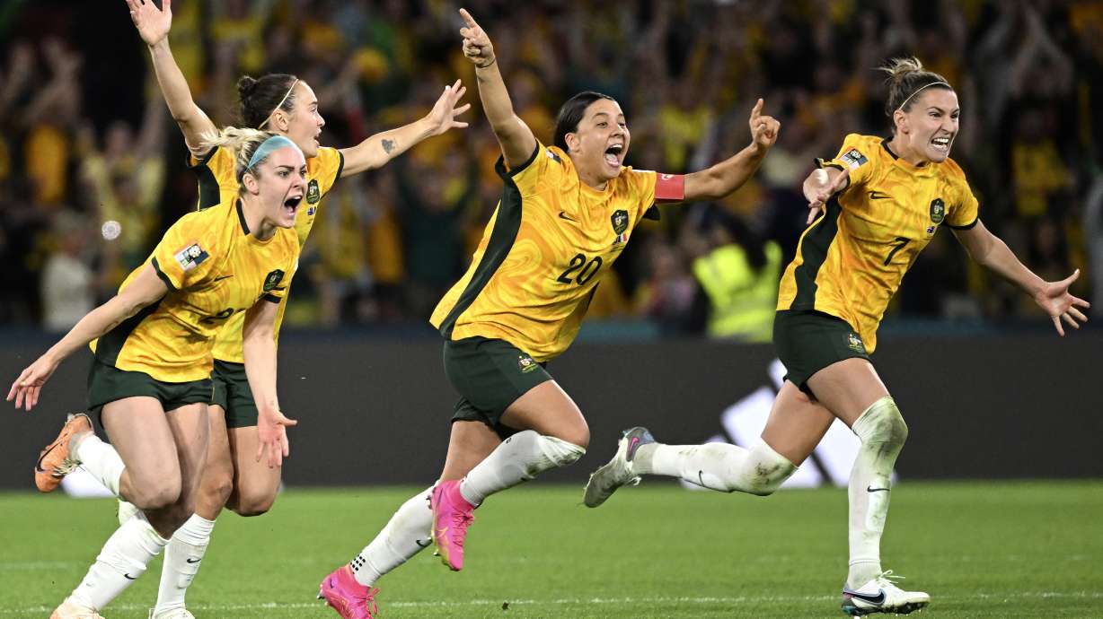 Australia's from left, Ellie Carpenter, Caitlin Foord, Sam Kerr and Steph Catley celebrate after Cortnee Vine kicked the winning penalty goal to defeat France in the Women's World Cup quarterfinal soccer match between Australia and France in Brisbane, Australia, Saturday, Aug.12, 2023.
