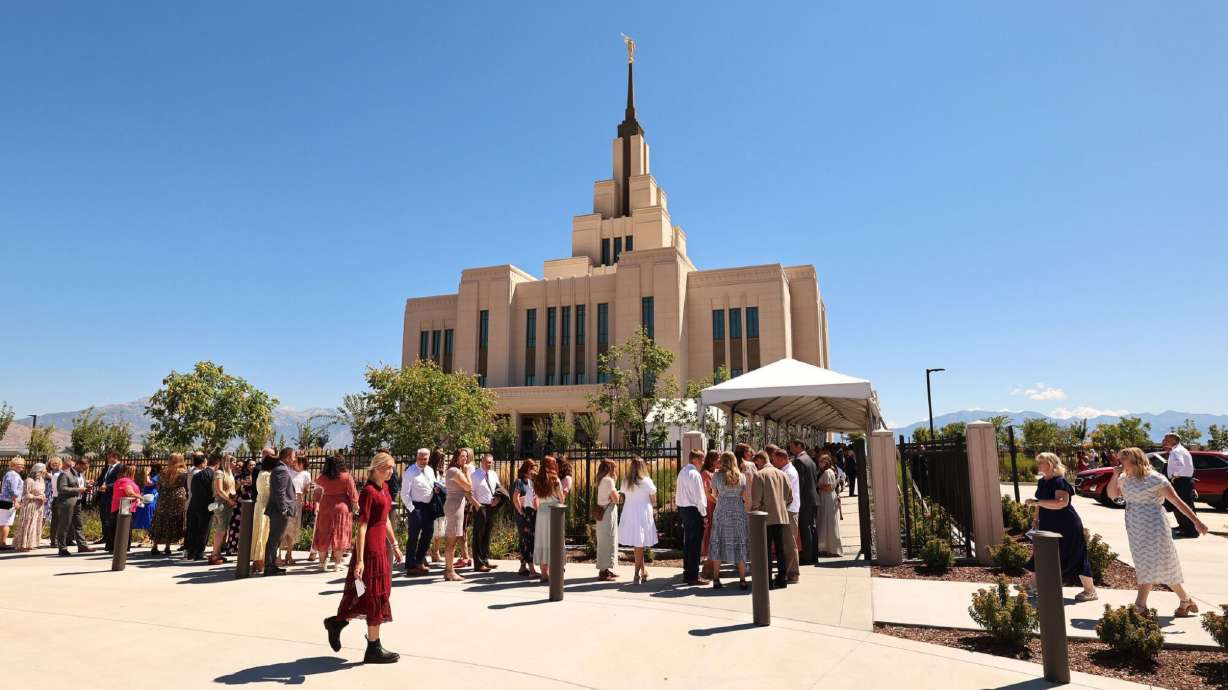 Attendees line up for the second session of the dedication of the Saratoga Springs Utah Temple of The Church of Jesus Christ of Latter-day Saints in Saratoga Springs on Sunday.