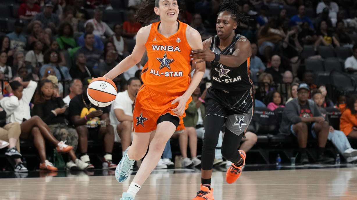 New York Liberty's Breanna Stewart, of Team Stewart, drives around Las Vegas Aces' Chelsea Gray, of Team Wilson, during the second half of a WNBA All-Star basketball game Saturday, July 15, 2023, in Las Vegas.