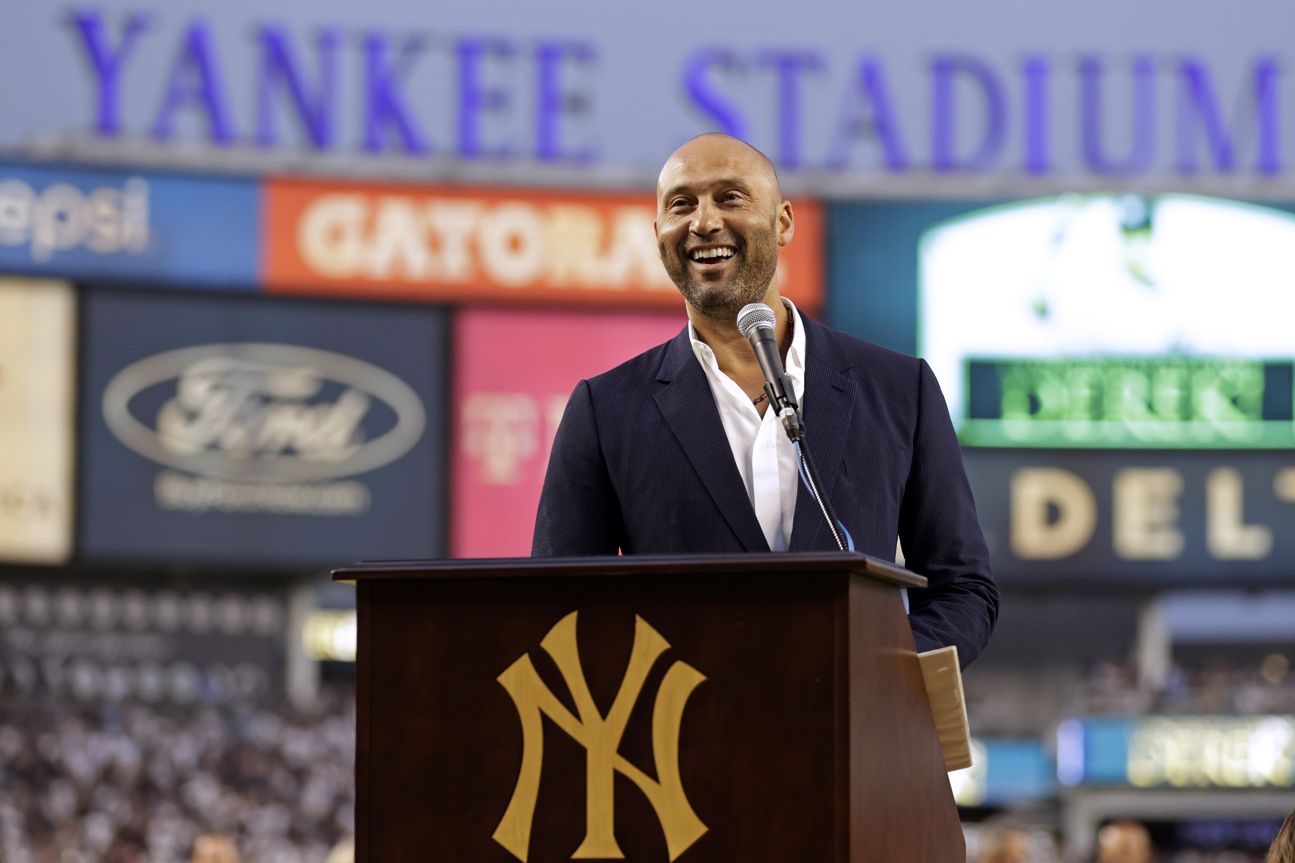 FILE - Derek Jeter speaks during a ceremony honoring his Hall of Fame induction before a baseball game between the Tampa Bay Rays and the New York Yankees, Friday, Sept. 9, 2022, in New York. Derek Jeter will attend Yankees' Old-Timers' Day for the first time since his retirement when New York honors the 25th anniversary of its 1998 World Series championship team on Sept. 9.