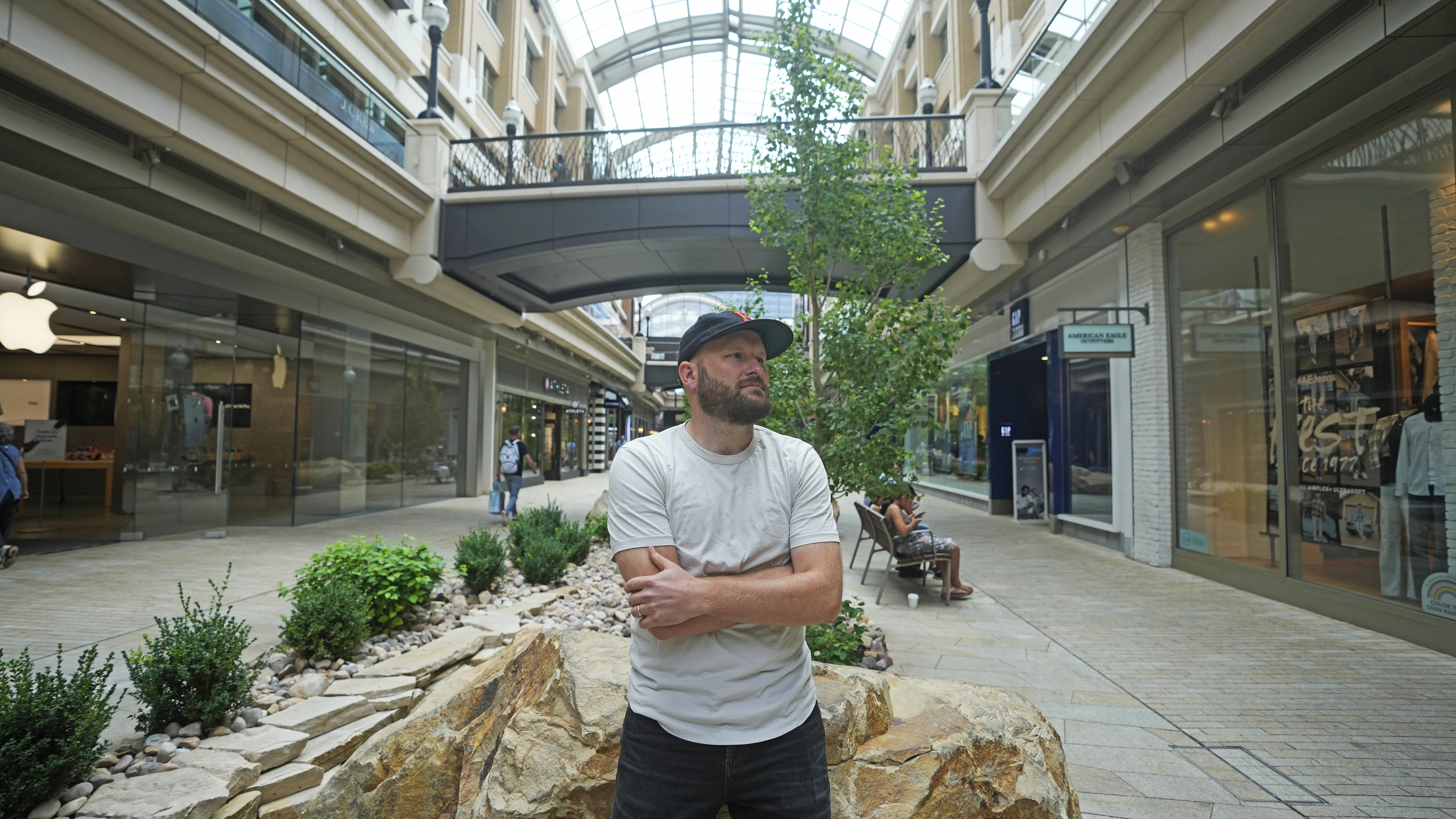 Jake Welch stands in open-air shopping center, Aug. 2, in Salt Lake City.