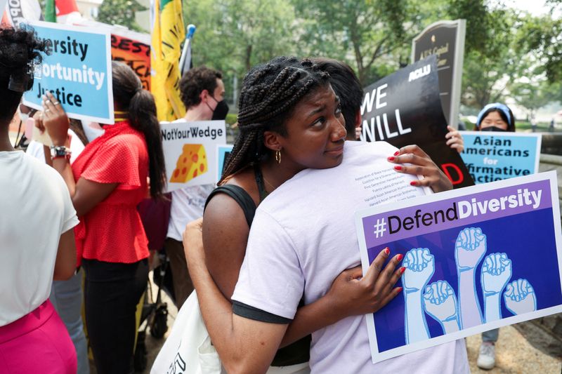 Demonstrators for and against the U.S. Supreme Court decision to strike down race-conscious student admissions programs at Harvard University and the University of North Carolina protest in Washington, June 29. The Biden administration urged diversity on campus with new guidance Monday.