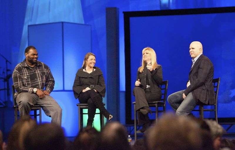 Michael Oher, left, Collins Tuohy, second from left, and Leigh Anne Tuohy, whose lives are portrayed in the Oscar-nominated movie "The Blind Side," speak with Pastor Kerry Shook, right, March 3, 2010 at Woodlands Church's Fellowship Campus in The Woodlands, TX. Michael Oher, the former NFL tackle known for the movie “The Blind Side,” filed a petition Monday in a Tennessee probate court accusing Sean and Leigh Anne Tuohy of lying to him by having him sign papers making them his conservators rather than his adoptive parents nearly two decades ago.