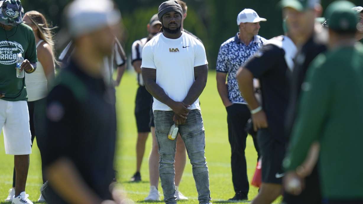 Running back Dalvin Cook watches a New York Jets practice session at the NFL football team's training facility in Florham Park, N.J., Sunday, July 30, 2023.