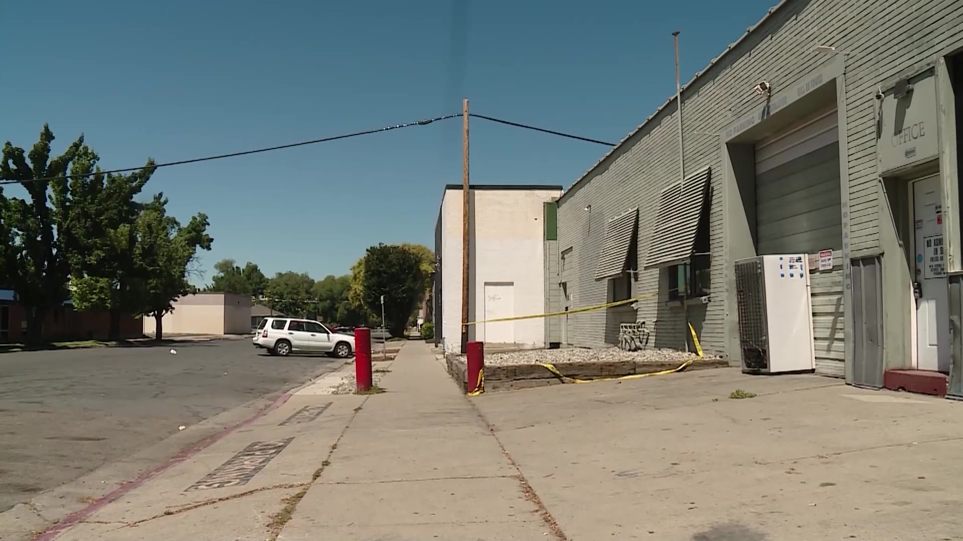 The scene of a shooting Sunday morning in Salt Lake City is sectioned off by crime scene tape. A business co-owner says this is not uncommon.