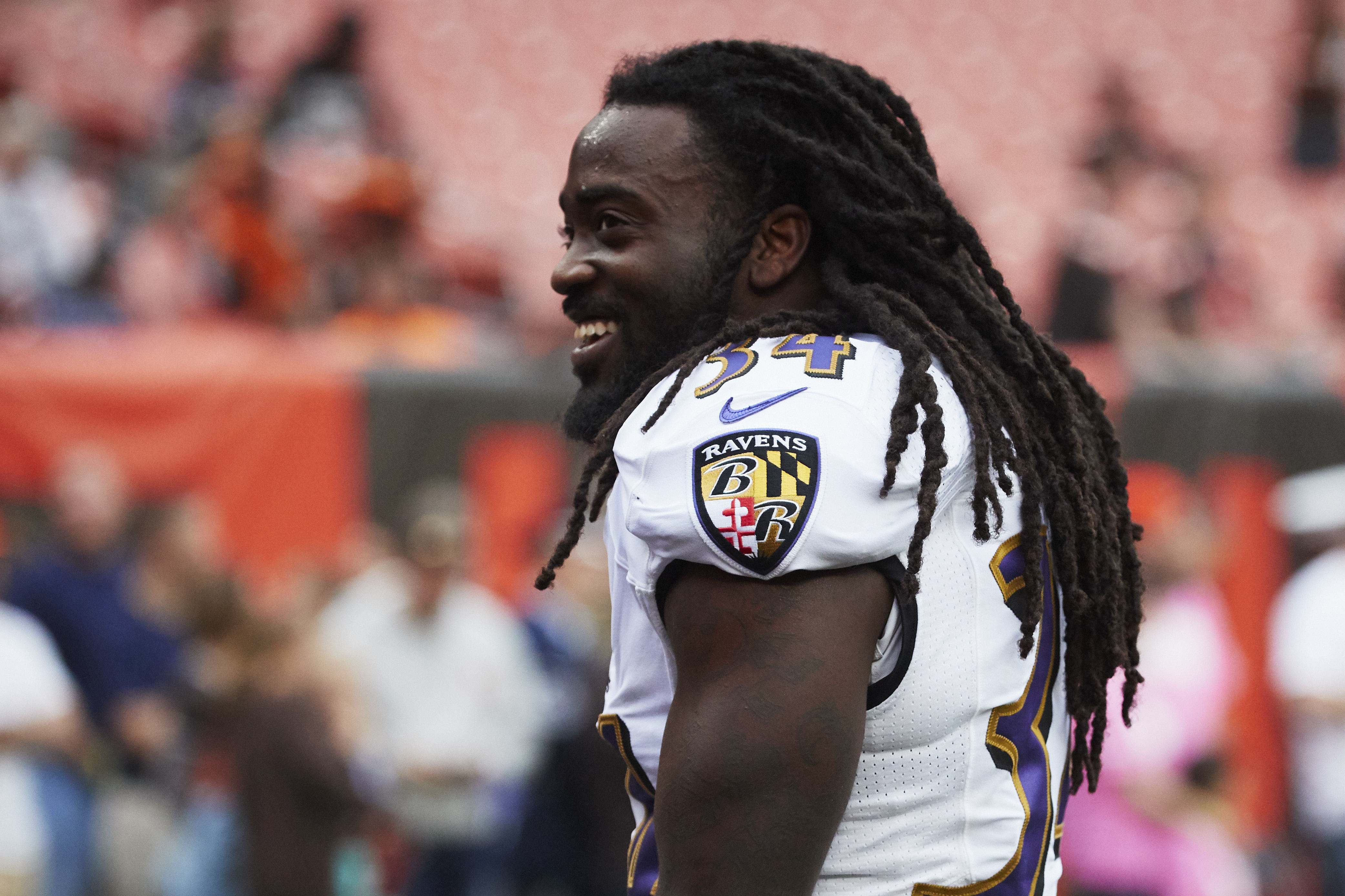 FILE - Baltimore Ravens running back Alex Collins attends during warmups prior to an NFL football game against the Cleveland Browns, Oct. 10, 2018, in Cleveland. Former NFL running back Collins, who played five seasons for the Seattle Seahawks and the Ravens after a terrific college career at Arkansas, has died. He was 28. The Seahawks released a statement from Collins' family that said he died Monday, Aug. 14, 2023.