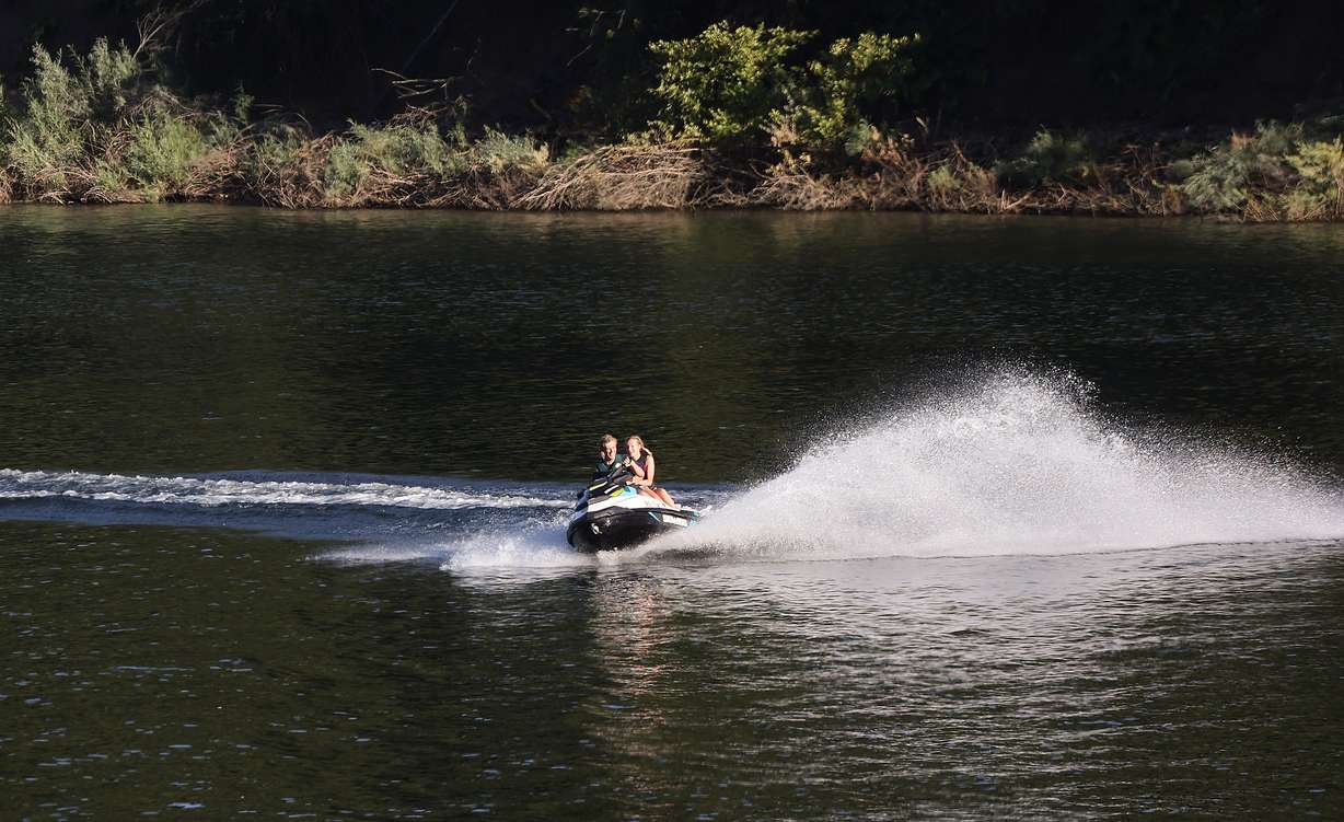 People jetski on Pineview Reservoir in Weber County on Monday. Utah's reservoir system remains at about 81% capacity entering this week.