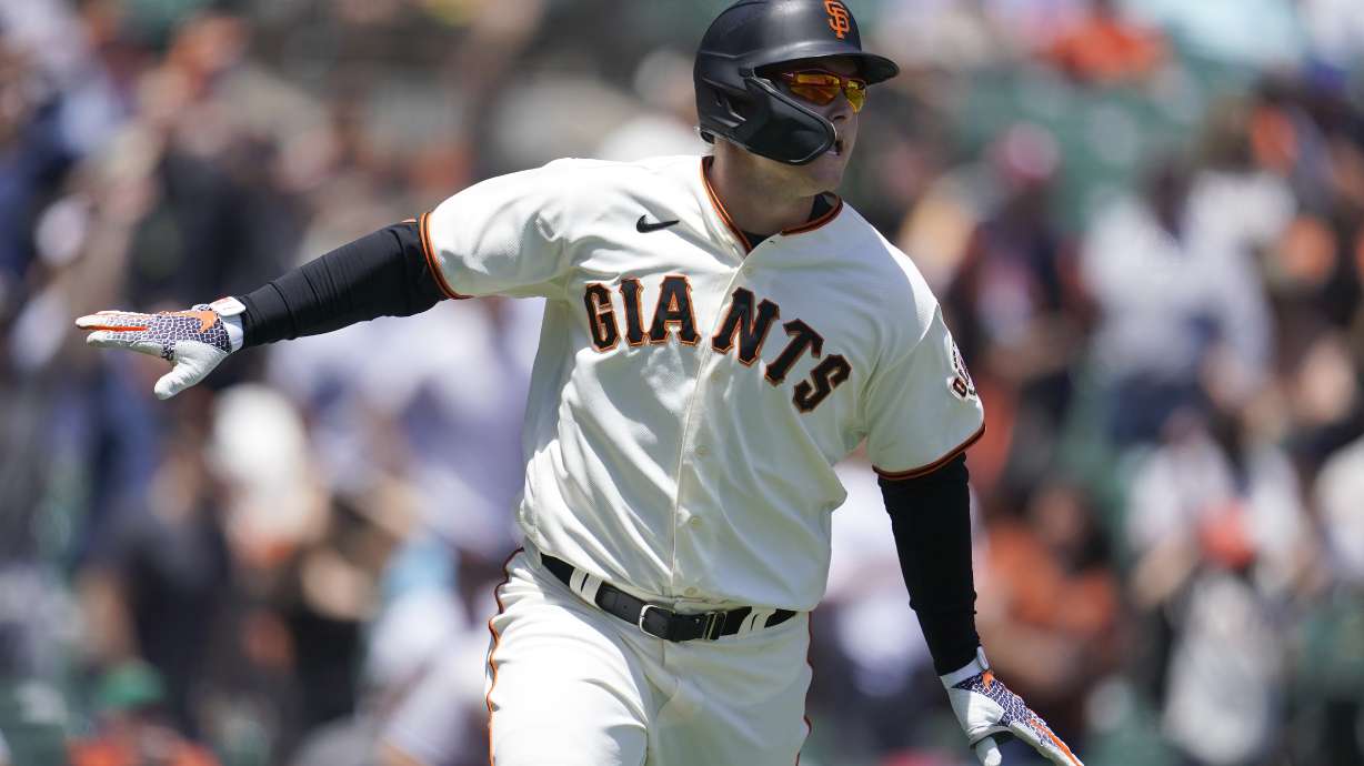 FILE - San Francisco Giants' Joc Pederson watches his two-run home run during the first inning of a baseball game against the New York Mets in San Francisco, Wednesday, May 25, 2022. Pederson is scared to fly and shortly after arriving in San Francisco he began working with the club's director of mental health and wellness Shana Alexander and human performance specialist Harvey Martin to cope with his flight anxiety.