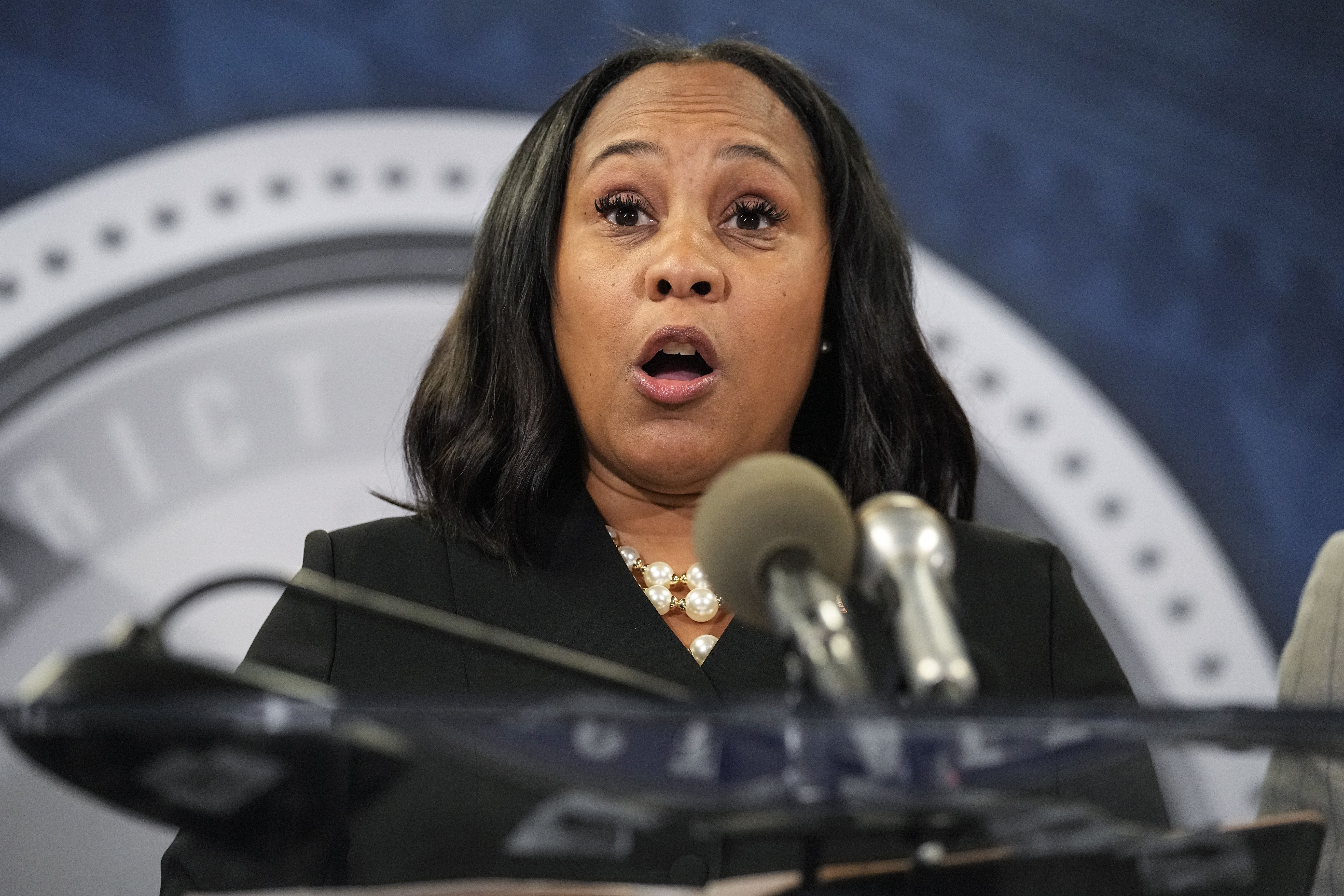 Fulton County District Attorney Fani Willis speaks in the Fulton County Government Center during a news conference, Monday in Atlanta. Donald Trump and several allies have been indicted in Georgia over efforts to overturn his 2020 election loss in the state.