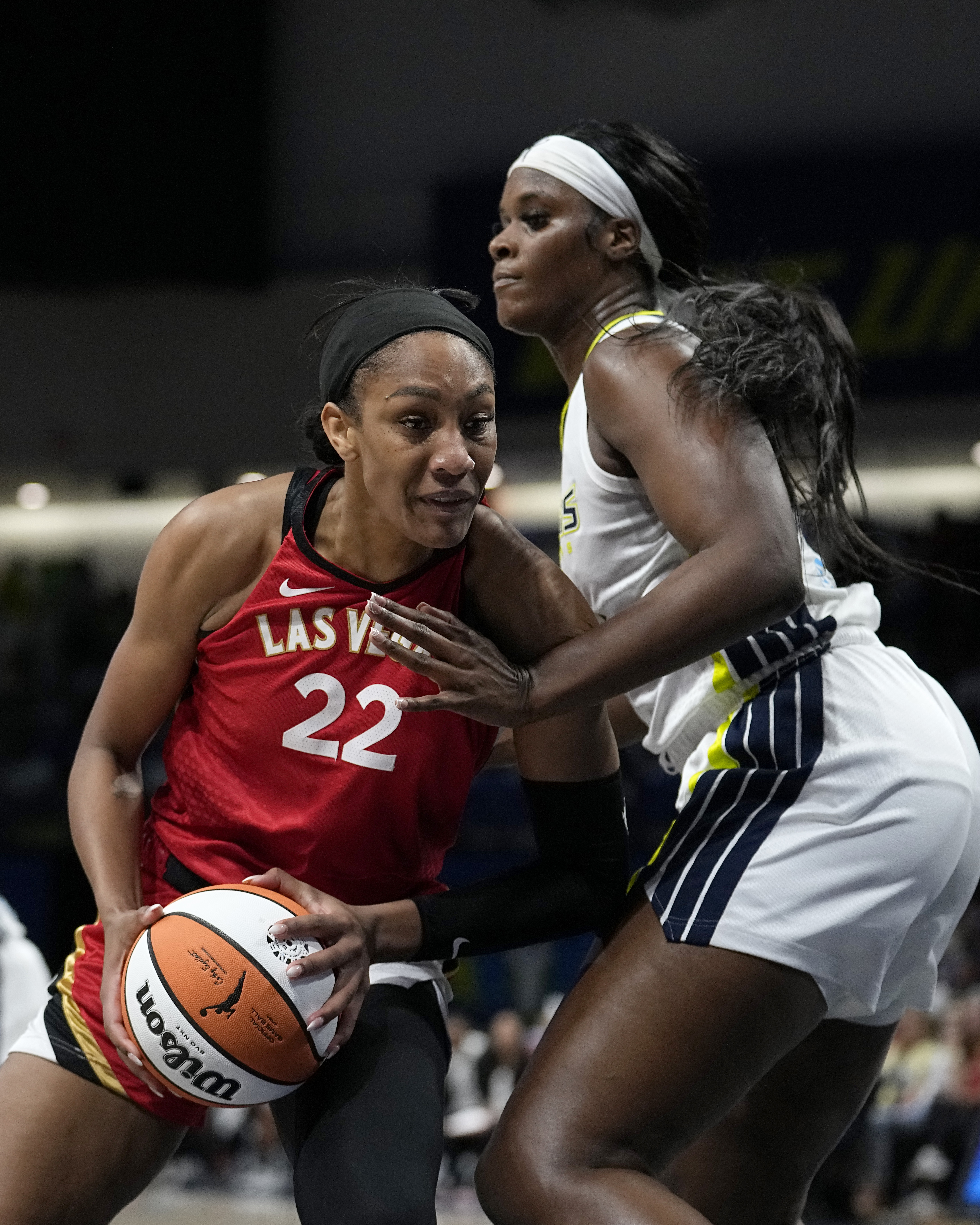 Las Vegas Aces forward A'ja Wilson (22) works for a shot as Dallas Wings' Kalani Brown, right, defends in the first half of a WNBA basketball game, Tuesday, Aug. 8, 2023, in Arlington, Texas. 