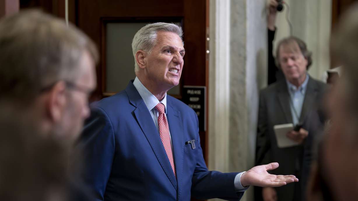 Speaker of the House Kevin McCarthy, R-Calif., talks to at the Capitol in Washington, July 25. Congressional leaders are pitching a stopgap government funding package to avoid a federal shutdown after next month.