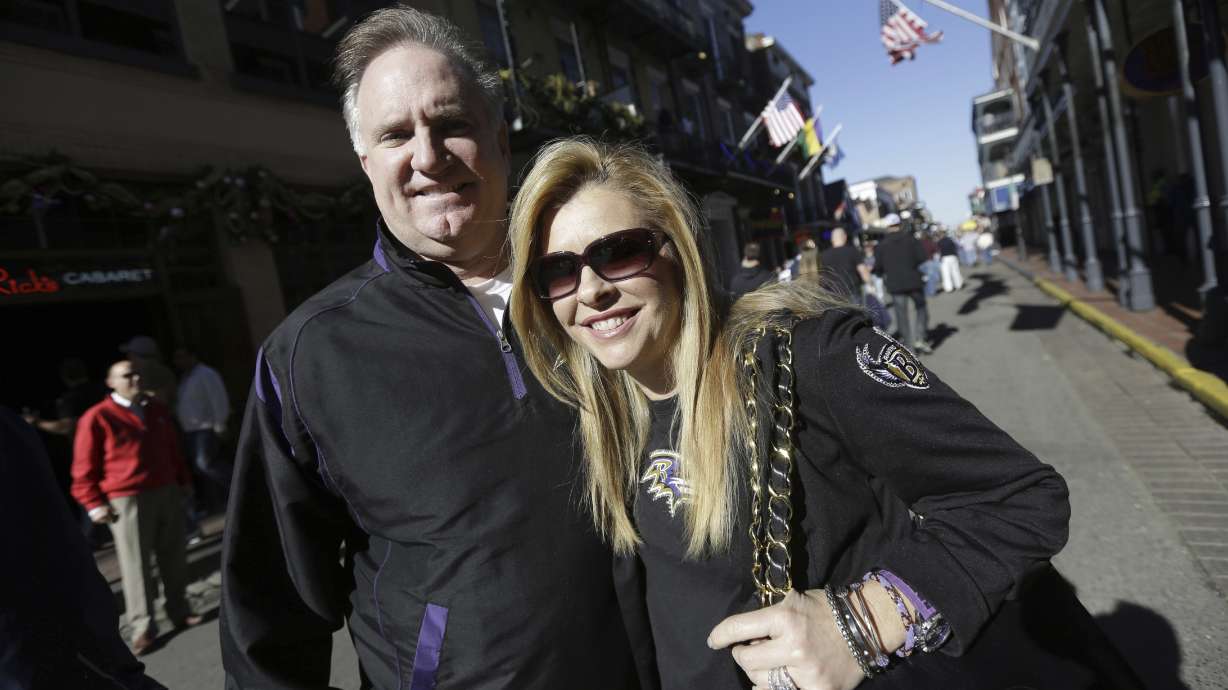 Sean and Leigh Anne Tuohy stand on a street in New Orleans, Feb. 1, 2013. They are calling Michael Oher's claims that they enriched themselves at his expense "outlandish," "hurtful and absurd" and part of a shakedown by the former NFL offensive tackle.