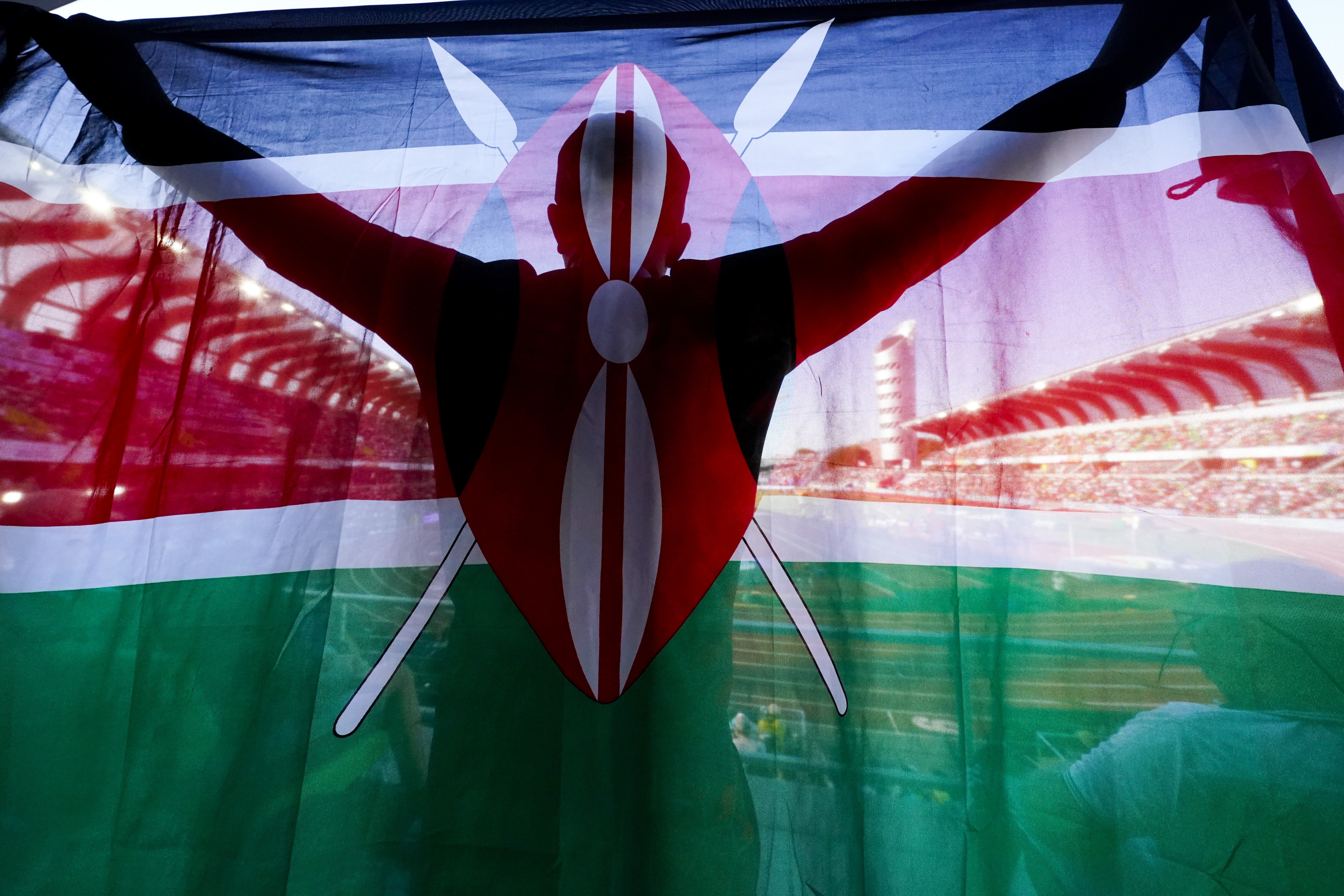 FILE - A fan of Kenya holds up a national flag during the final in the women's 5000-meter run at the World Athletics Championships on July 23, 2022, in Eugene, Ore. Kenya has achieved unparalleled success in modern distance running, but a wave of positive drug tests over the last decade has ruined that reputation, made it the sport's latest doping pariah, and pushed it to the brink of a sweeping international ban that would sit it alongside Russia. 