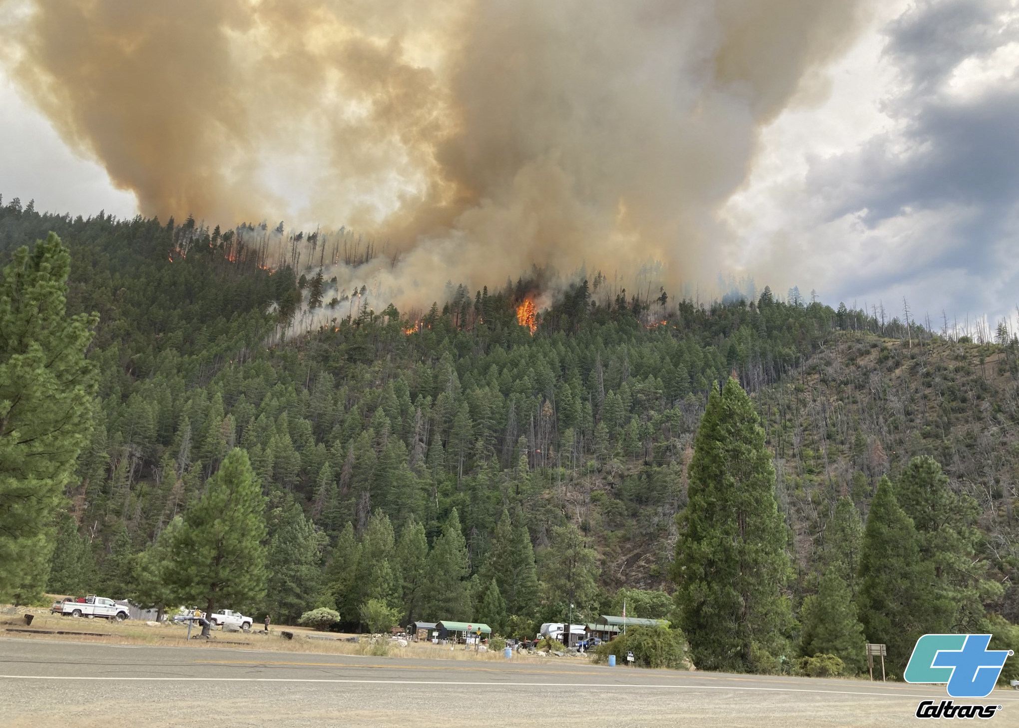 Smoke rises from the Head Fire in Klamath National Forest, Calif., Tuesday. A wildfire pushed by gusty winds from a thunderstorm raced through national forest land near California's border with Oregon, prompting evacuations in the rural area. 