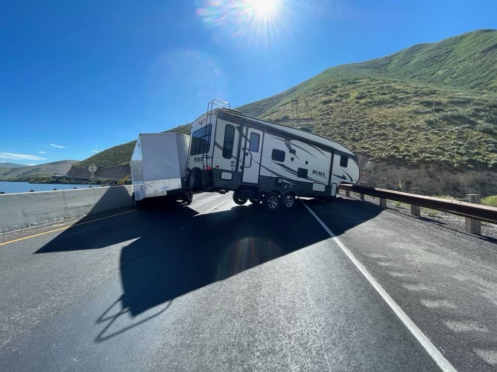 Eastbound U.S. 189 was closed near Deer Creek Dam for couple of hours Wednesday after a crash involving a truck pulling a travel trailer and a second trailer.