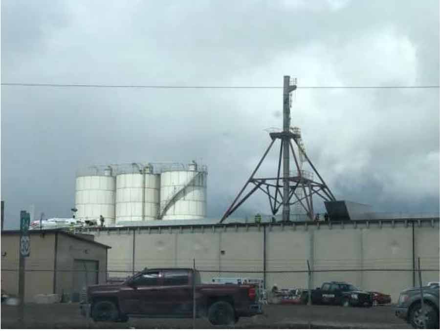 An aircraft on the roof of Gem State Processing is seen in this photo showing the exhaust stack and the steam cloud. The parents of a pilot killed in a plane crash last year say the city of Burley, an Idaho food processing plant and other entities are responsible for their daughter’s death, and now they’re suing.