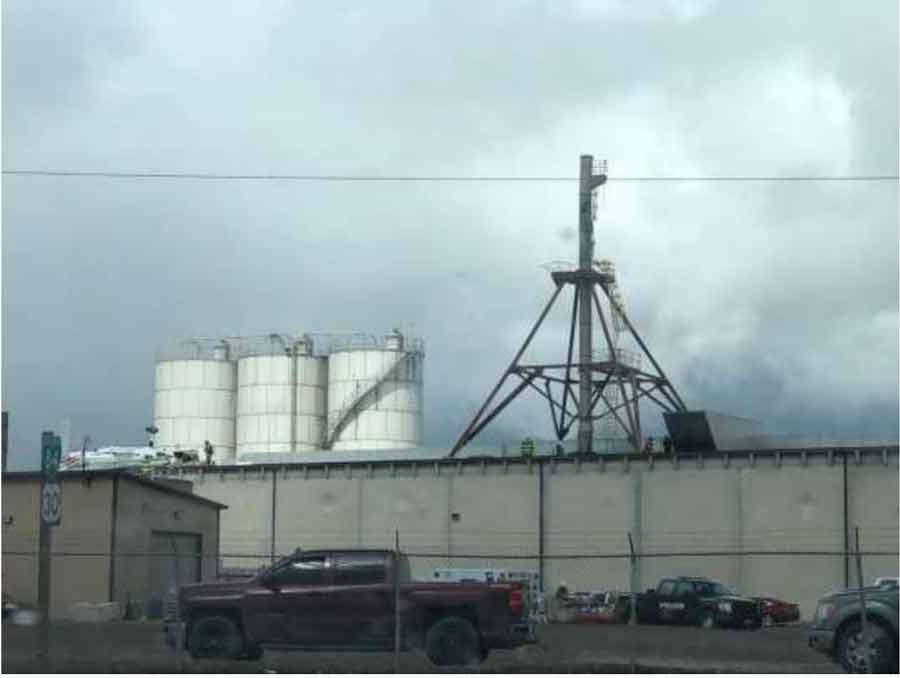 An aircraft on the roof of Gem State Processing is seen in this photo showing the exhaust stack and the steam cloud. The parents of a pilot killed in a plane crash last year say the city of Burley, an Idaho food processing plant and other entities are responsible for their daughter’s death, and now they’re suing.