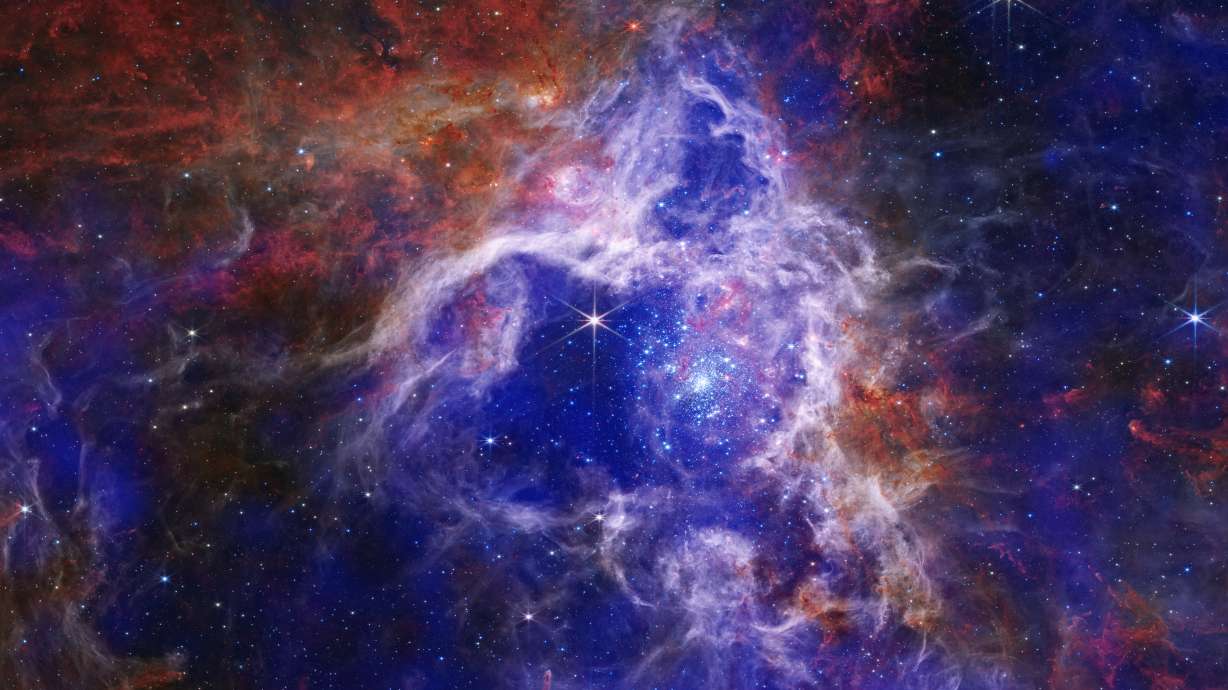 A composite image of the Tarantula Nebula. UVU professor Joshua Lothringer helped discover the presence of carbon dioxide on an exoplanet 700 light years from Earth, using the James Webb Space Telescope.