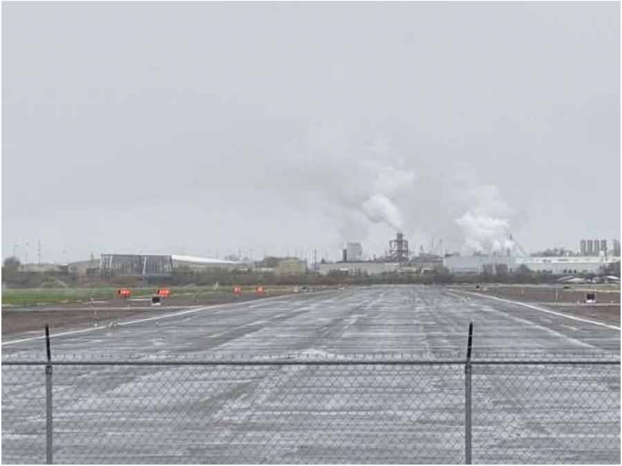 Photo taken from the departure end of Runway 02 at Burley Airport, looking northeast at the Gem State Processing Plant and its steam stacks. The parents of a pilot killed in a plane crash last year say the city of Burley, an Idaho food processing plant and other entities are responsible for their daughter’s death, and now they’re suing.