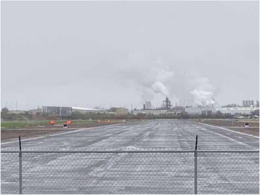 Photo taken from the departure end of Runway 02 at Burley Airport, looking northeast at the Gem State Processing Plant and its steam stacks. The parents of a pilot killed in a plane crash last year say the city of Burley, an Idaho food processing plant and other entities are responsible for their daughter’s death, and now they’re suing.