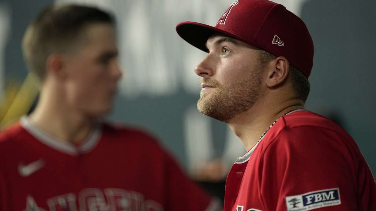 Los Angeles Angels' Reid Detmers stands in the dugout before the eighth inning of a baseball game against the Texas Rangers, Wednesday, Aug. 16, 2023, in Arlington, Texas.