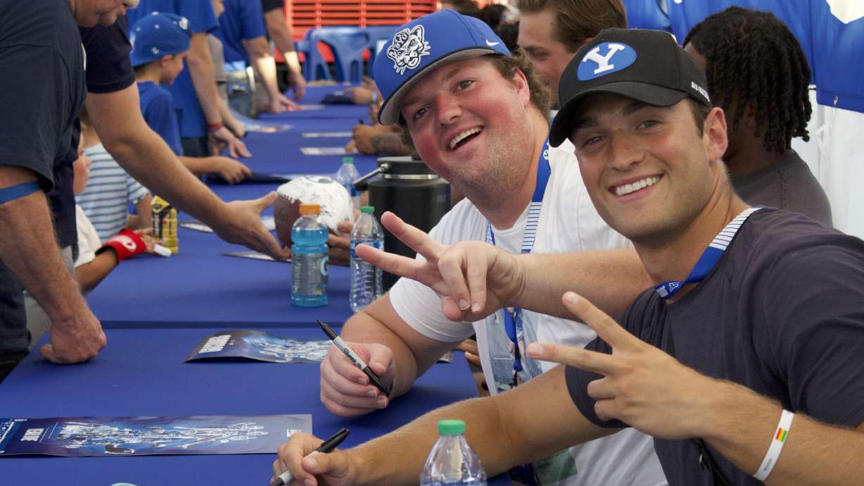 BYU wide receiver Chase Roberts, right, and offensive lineman Connor Pay pose during the Cougar Kickoff held Wednesday night, Aug. 16, 2023, in Provo.