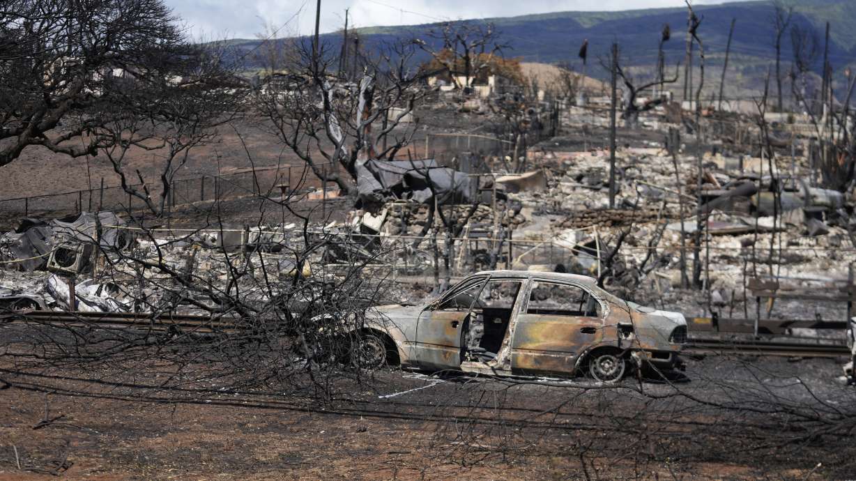 Destroyed property is seen Sunday in Lahaina, Hawaii, following a deadly wildfire. Hawaii's governor has vowed to protect local landowners from being "victimized" by opportunistic buyers when Maui rebuilds.