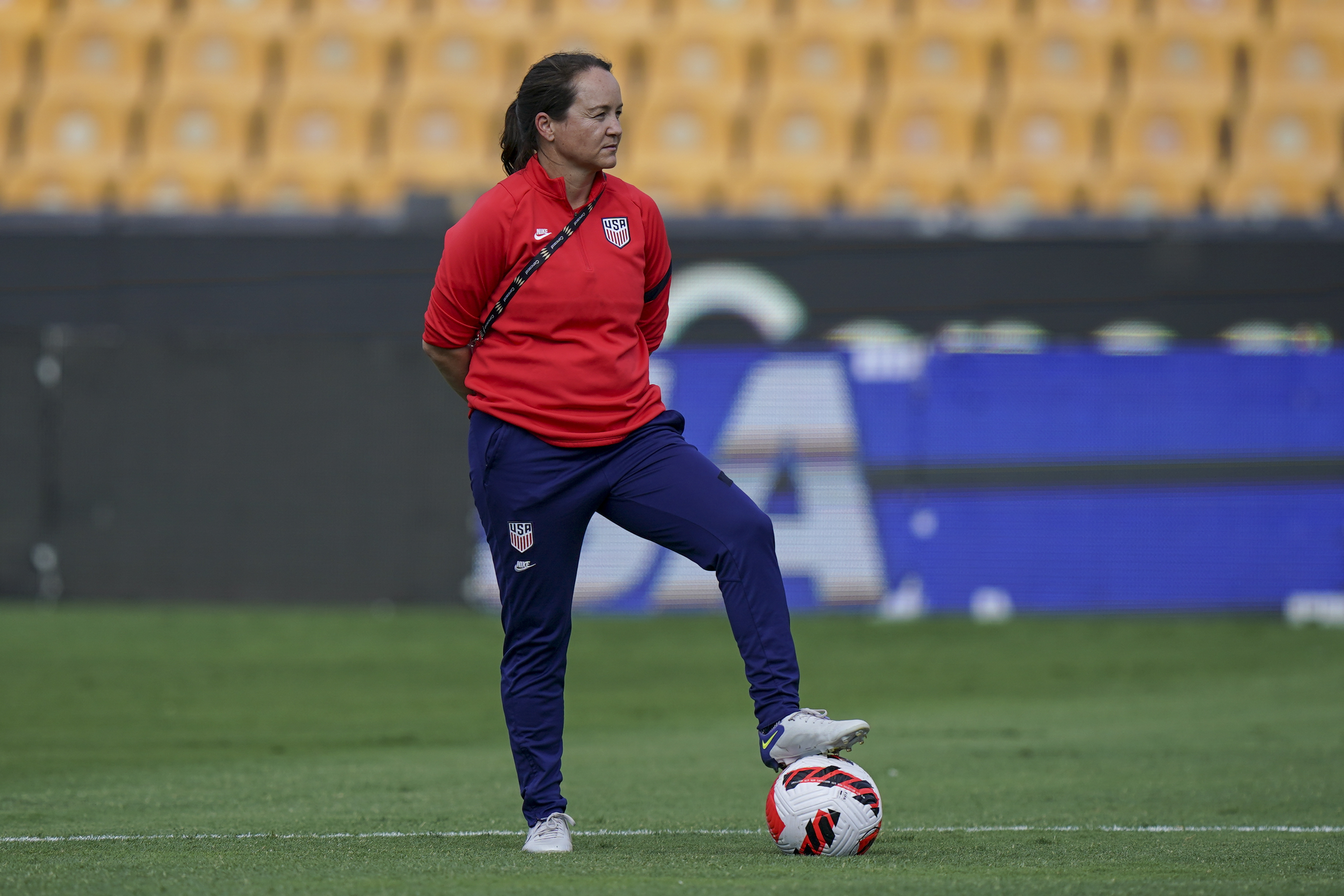 FILE - Twila Kilgore, assistant coach on the U.S. team watches players warm up prior to a CONCACAF women's championship soccer semifinal match against Costa Rica in Monterrey, Mexico, Thursday, July 14, 2022. Kilgore will serve as interim coach of the U.S women’s national team following the resignation of coach Vlatko Andonovski. U.S. Soccer formally announced Andonovski’s resignation on Thursday, Aug. 17. 
