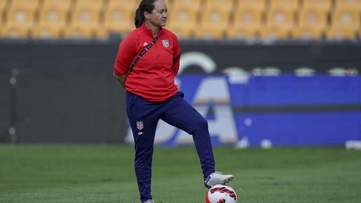 FILE - Twila Kilgore, assistant coach on the U.S. team watches players warm up prior to a CONCACAF women's championship soccer semifinal match against Costa Rica in Monterrey, Mexico, Thursday, July 14, 2022. Kilgore will serve as interim coach of the U.S women’s national team following the resignation of coach Vlatko Andonovski. U.S. Soccer formally announced Andonovski’s resignation on Thursday, Aug. 17.