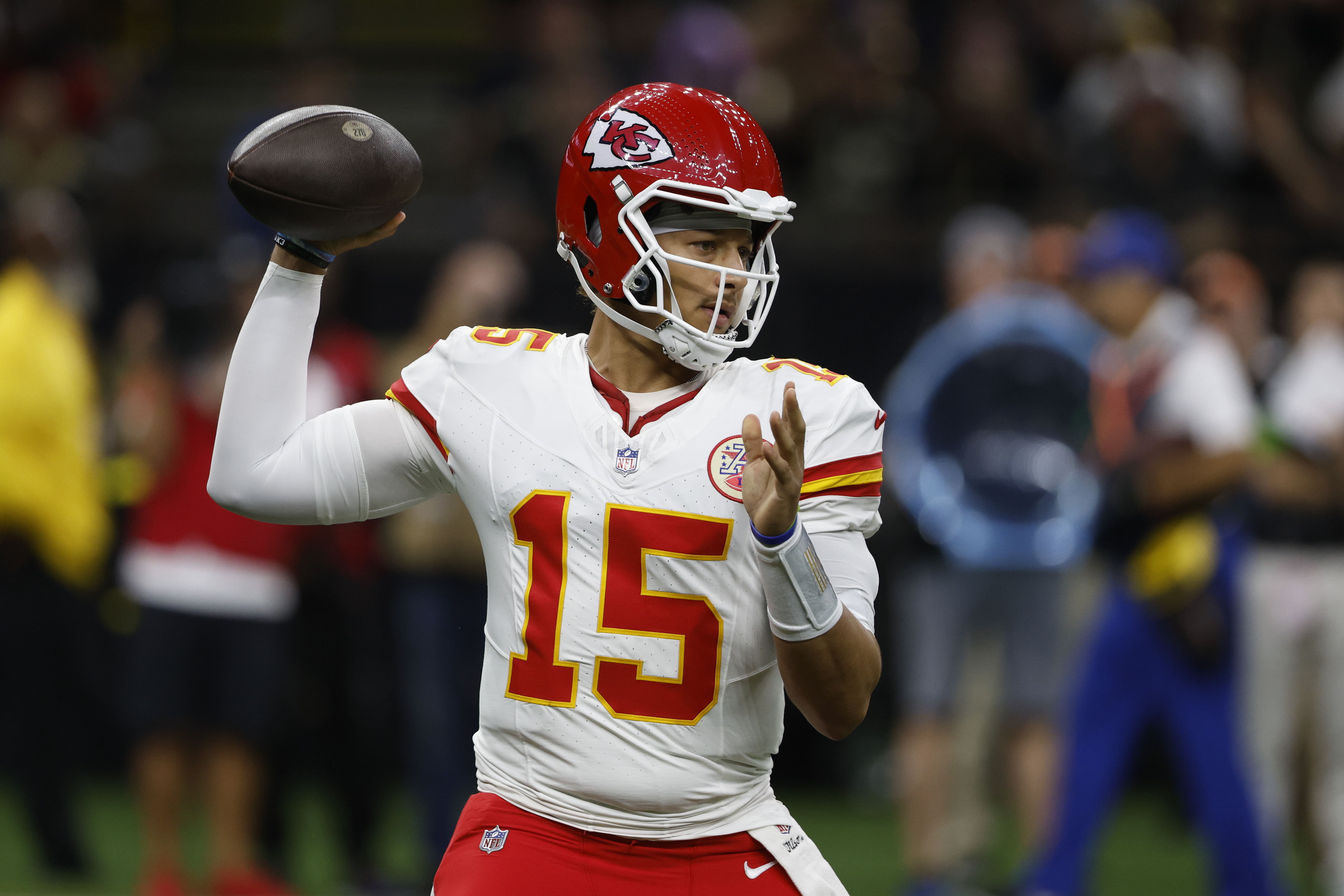 Kansas City Chiefs quarterback Patrick Mahomes (15) sets back to pass in the first half of a preseason NFL football game against the New Orleans Saints in New Orleans, Sunday, Aug. 13, 2023.