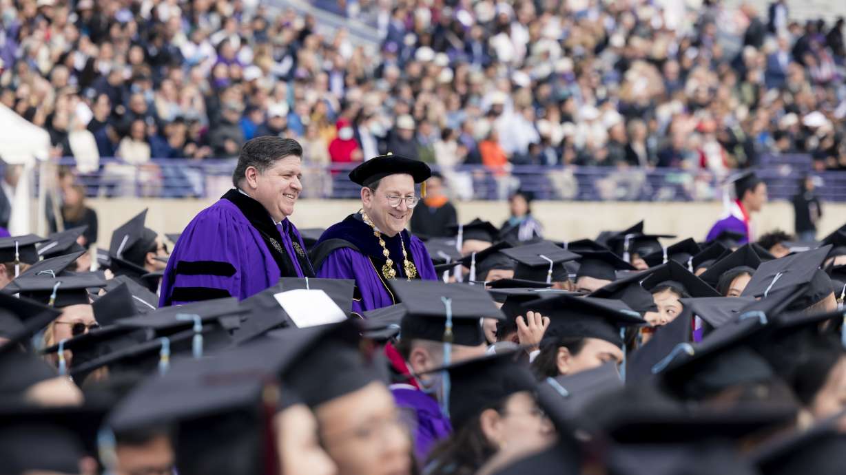 Gov. J.B. Pritzker walks alongside Michael H Schill, President of Northwestern, at the 156th annual commencement ceremony at Ryan Field Stadium at Northwestern University in Evanston, Ill., Monday, June 12, 2023. Gov. J.B. Pritzker received the Honorary Doctor of Laws for his work in the public sector.