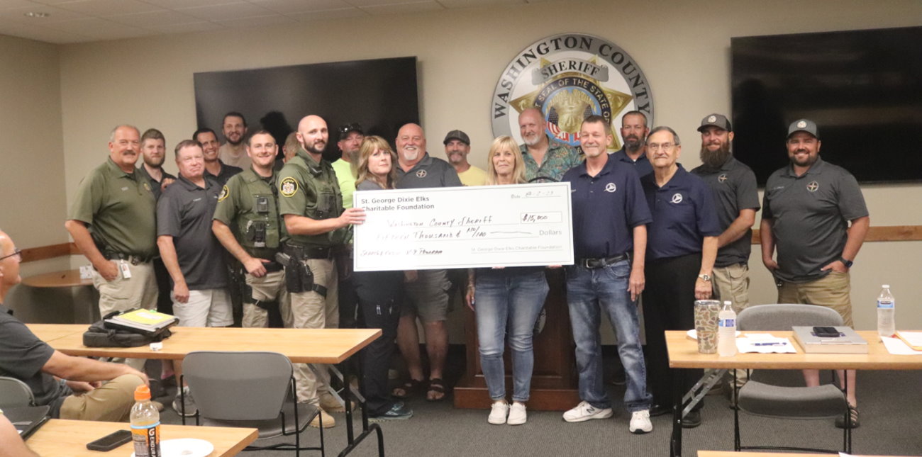 The St. George Elks Charitable Foundation presents a $15,000 check to the Washington County Sheriff’s Search and Rescue team for a new K-9 program, Hurricane, Aug. 2.