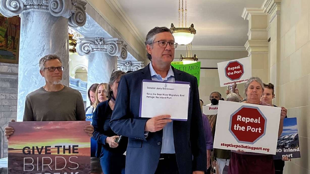 Jonny Vasic, executive director at Utah Physicians for a Health Environment, leads a group to deliver a petition opposing the Golden Spike Inland Port Project Area at the Capitol Thursday.