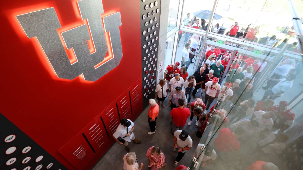 People tour the Dumke Gymnastics Center during a ribbon-cutting event at the University of Utah in Salt Lake City on Thursday, Aug. 17, 2023.