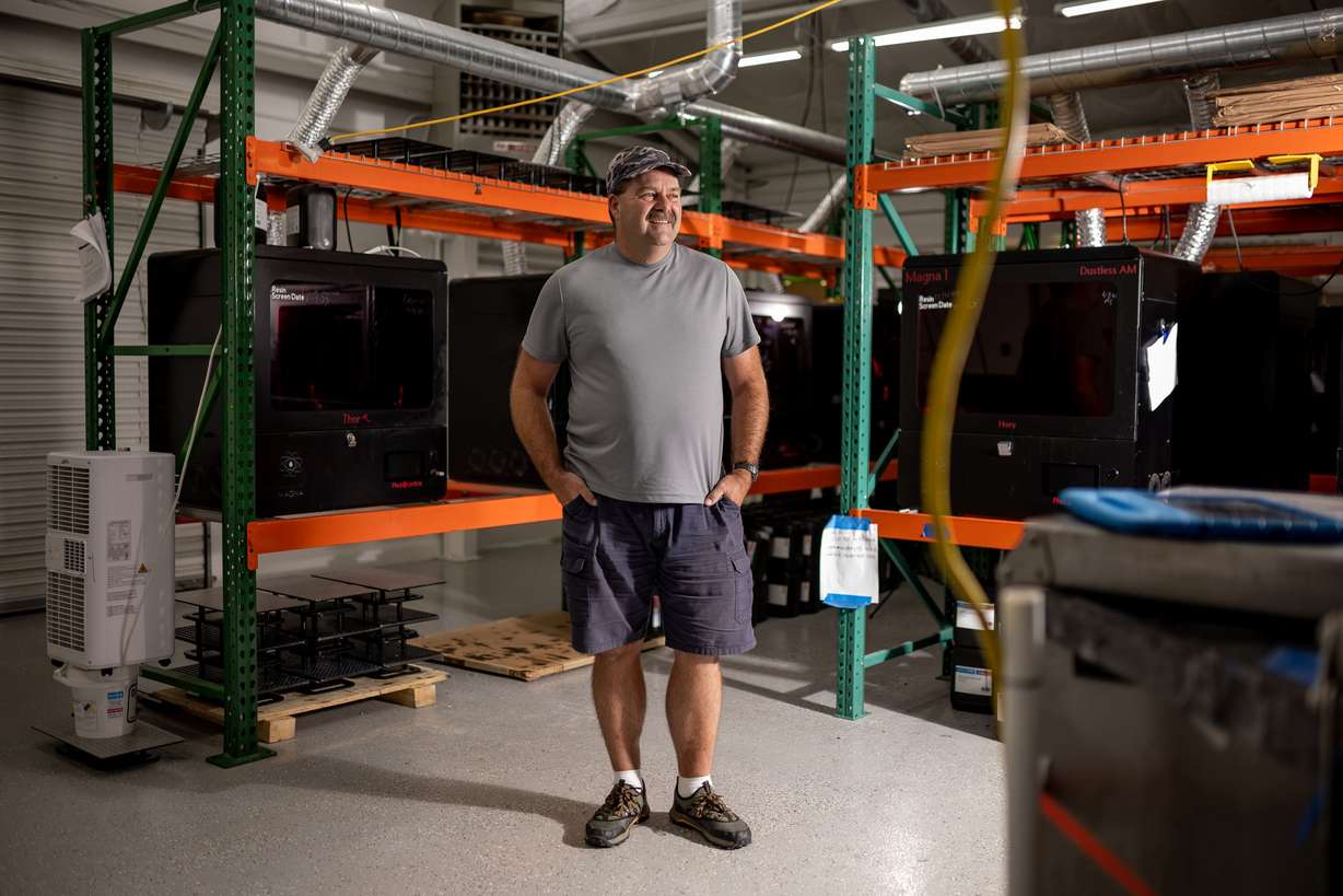 Justin Slaughter, a designer at Merit3D in Price, poses for a photo on Thursday. Slaughter spent 24 years in the mining industry, including working underground in a coal mine, before working at Merit3D.