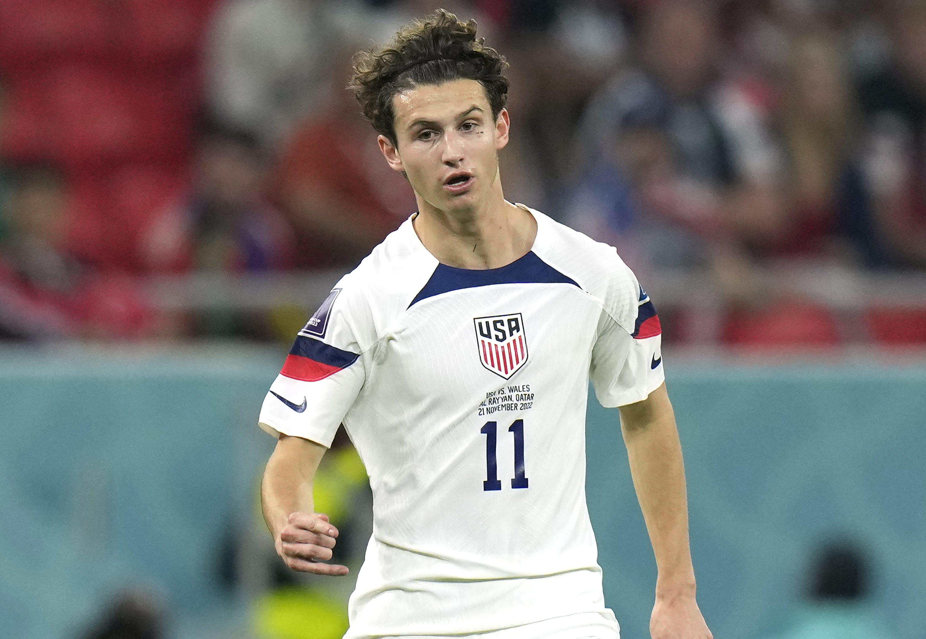FILE - Brenden Aaronson of the United States in action during the World Cup, group B soccer match between the United States and Wales at the Ahmad Bin Ali Stadium in Doha, Qatar, Monday, Nov. 21, 2022. Union Berlin is looking to a fresh-faced kid from Medford, New Jersey for experience as it embarks on its first-ever Champions League season. United States midfielder Brenden Aaronson will be one of the few players in Union’s squad to have played in Europe’s biggest and most important club competition when it begins in late September. 
