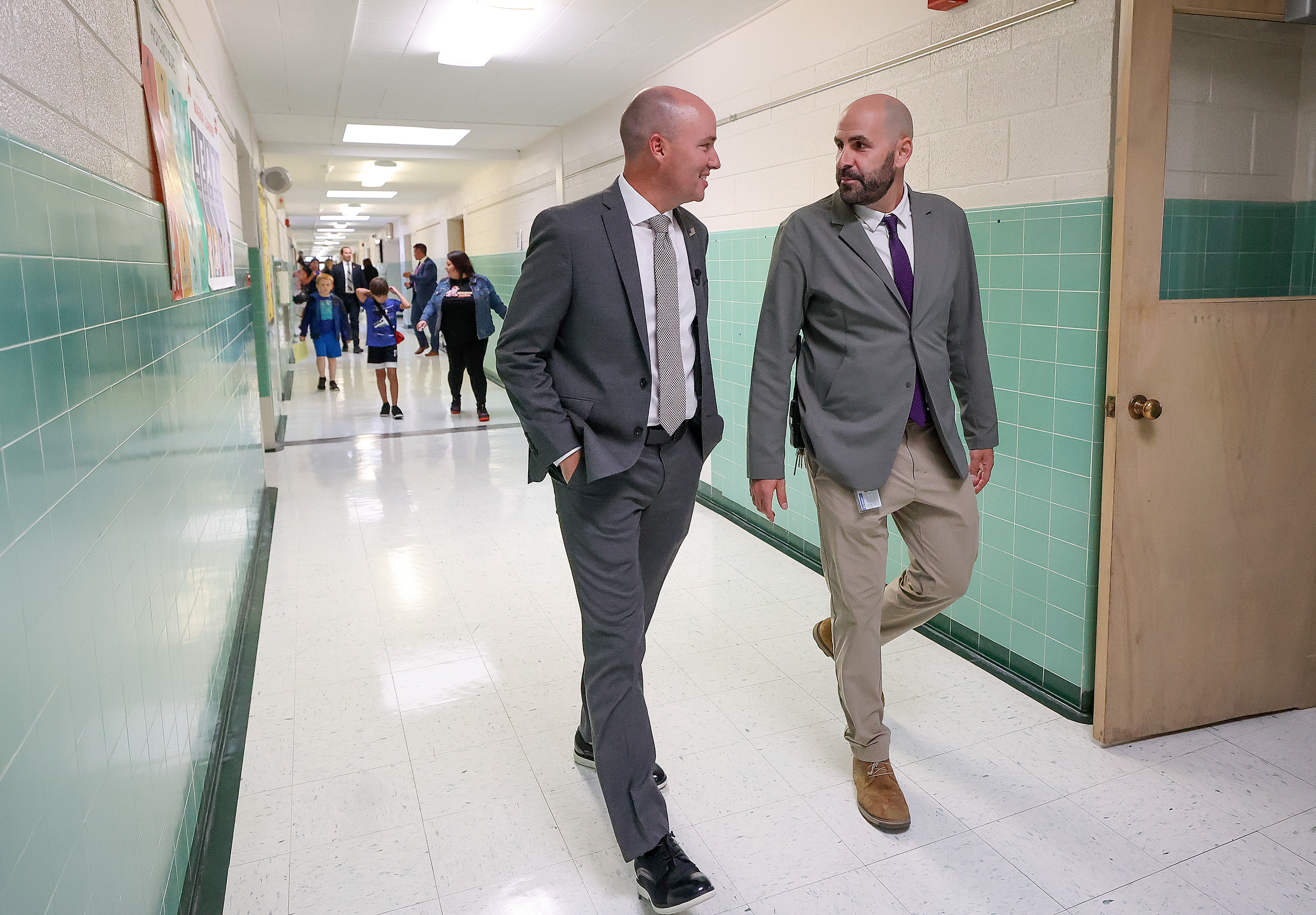 Utah Gov. Spencer Cox talks with Magna Elementary School principal Benjamin Peters while visiting Magna Elementary School in Magna on Friday.